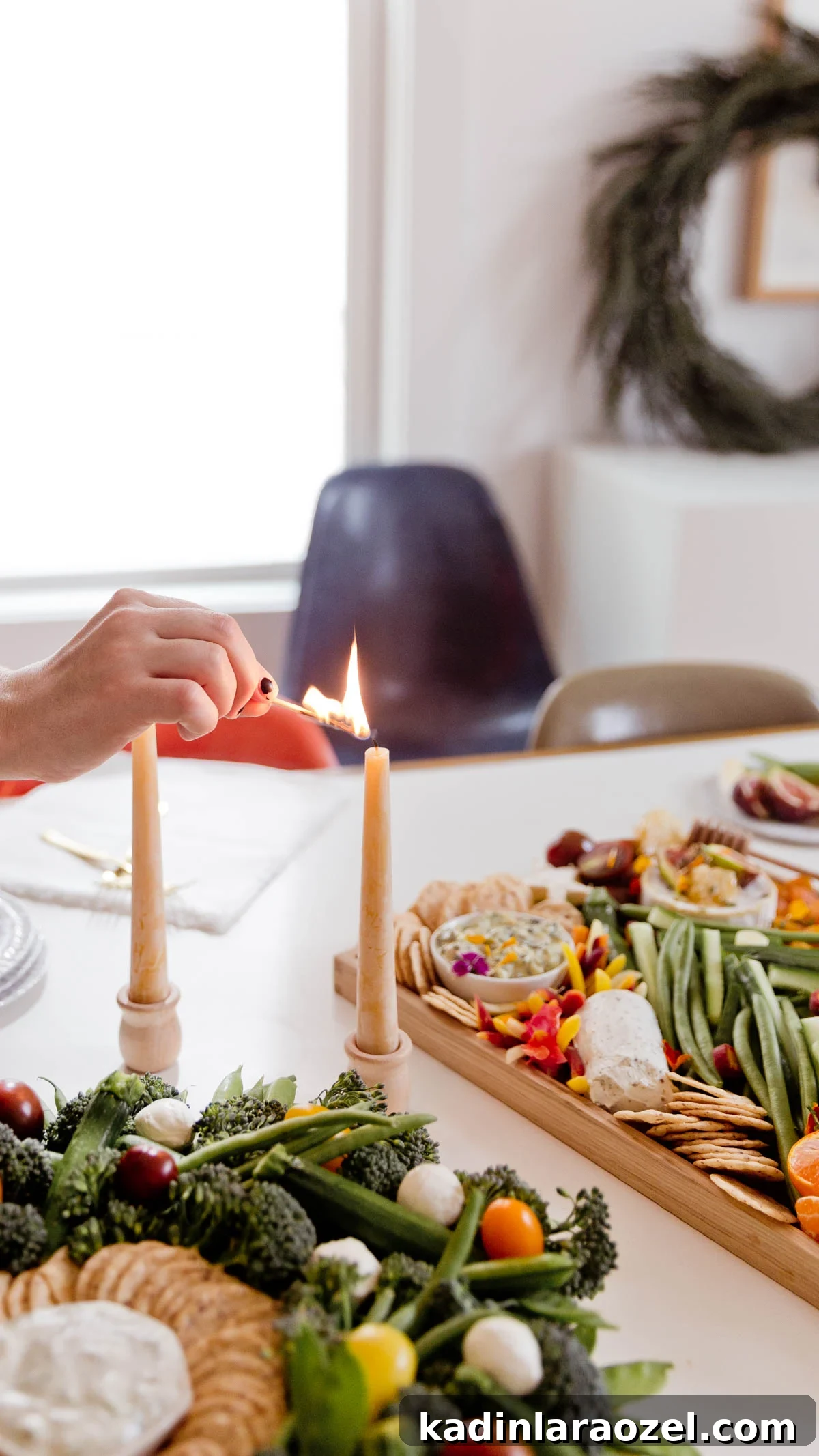 Festive Christmas Charcuterie Board Ideas for Holiday Entertaining 5 Lighting candles on a white table, with charcuterie serving platters nearby