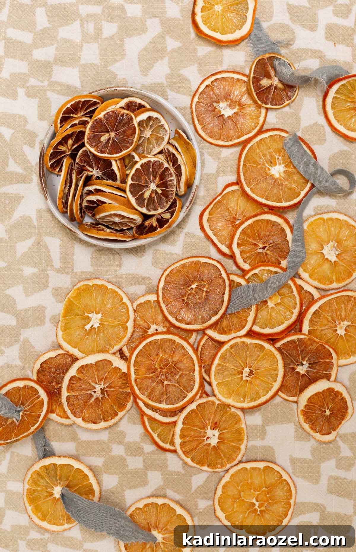 thinly slices orange slices, dried out, and ready to use for decorative holiday garlands 