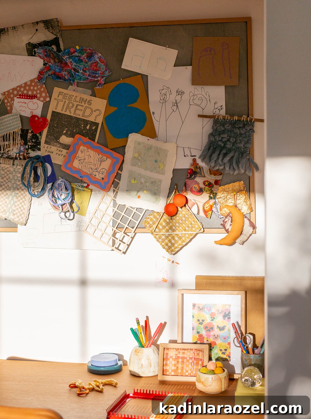 Guest Bedroom Closet Desk Makeover: DIY Small-Space Workstation 15 bulletin board over a desk filled with crafts, artwork, and doodles