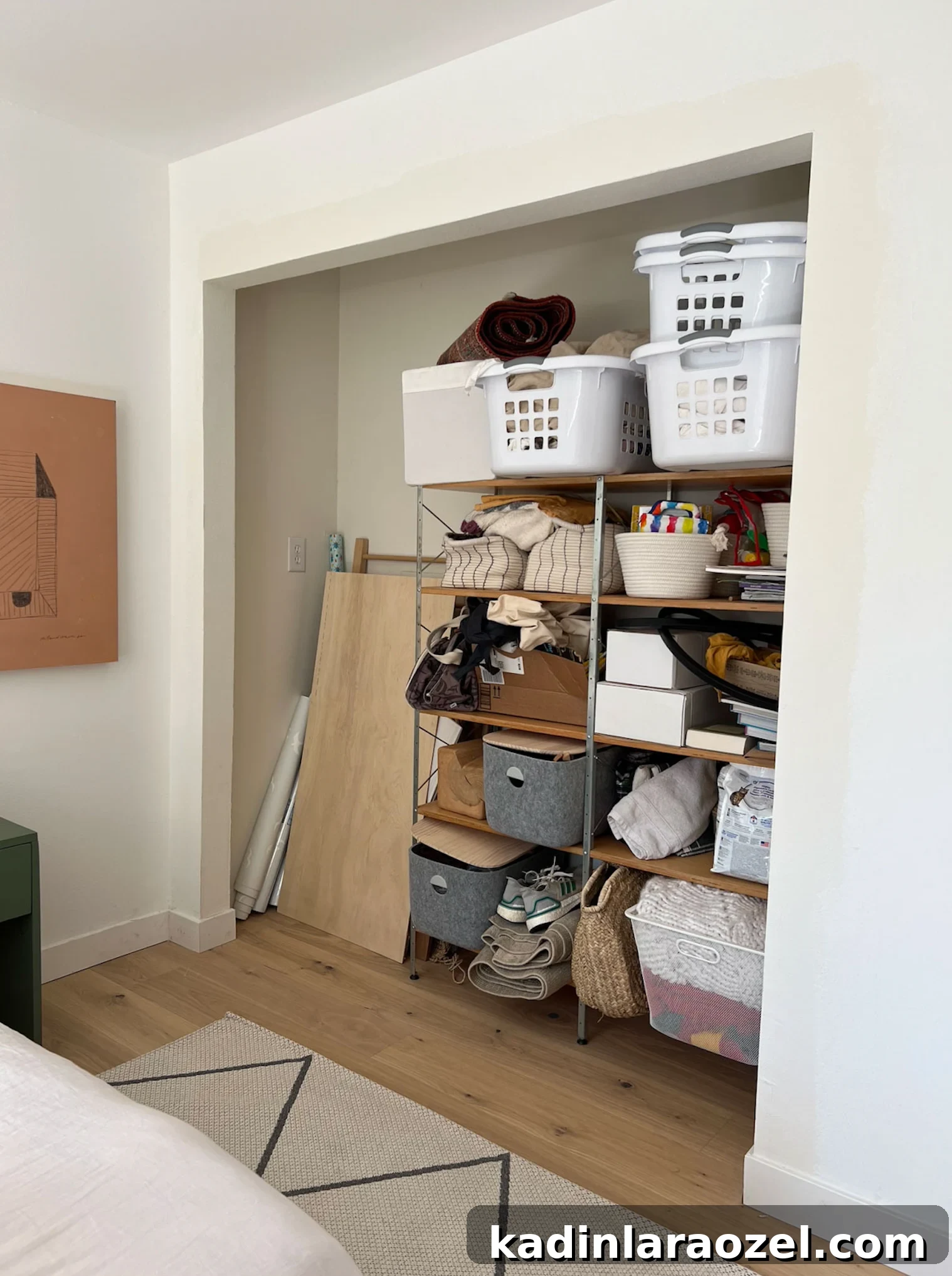 Guest Bedroom Closet Desk Makeover: DIY Small-Space Workstation 6 packed closet in a guest bedroom with no closet doors