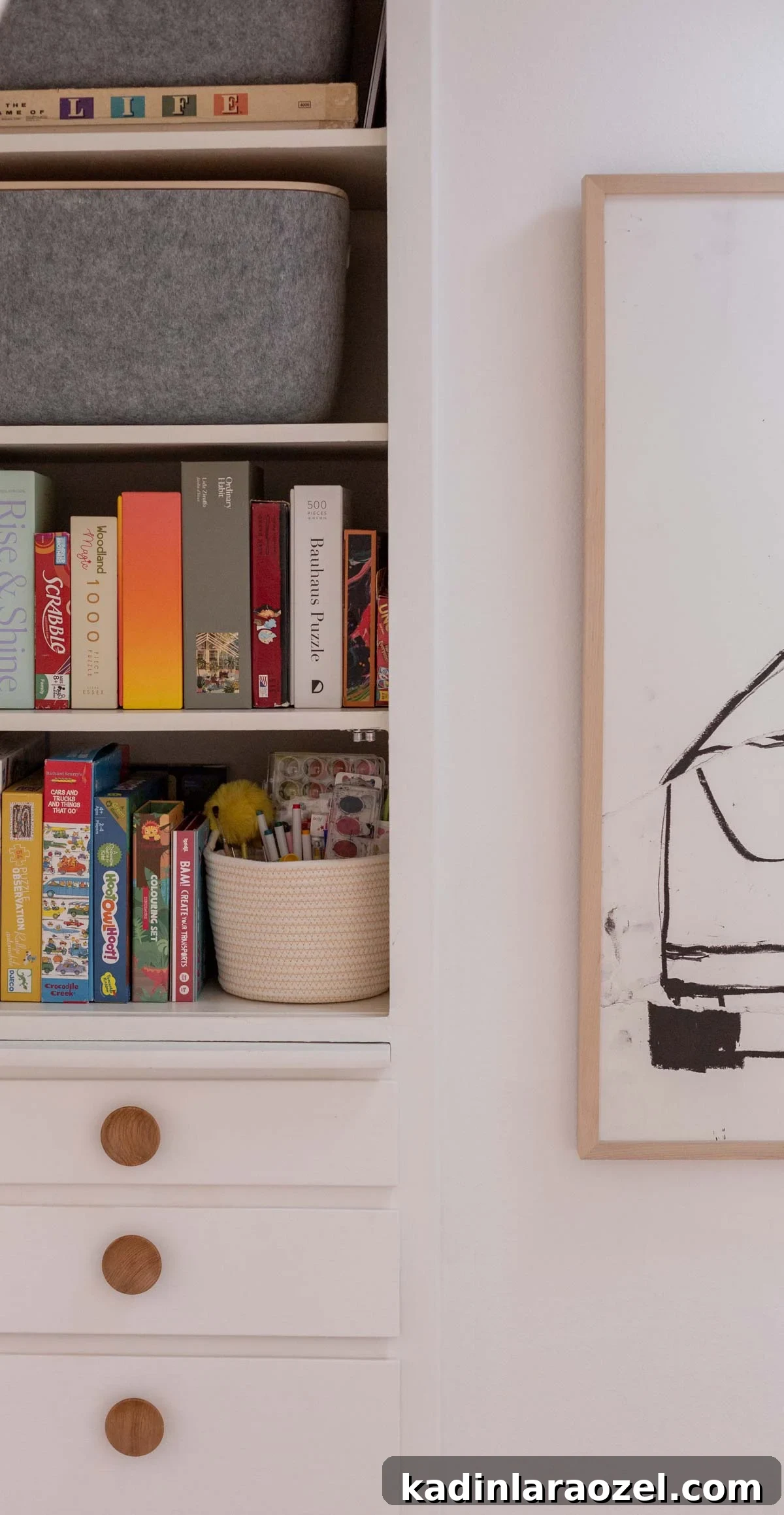 organized hall closet with board games and puzzles lined up, alongside felt organizational bins