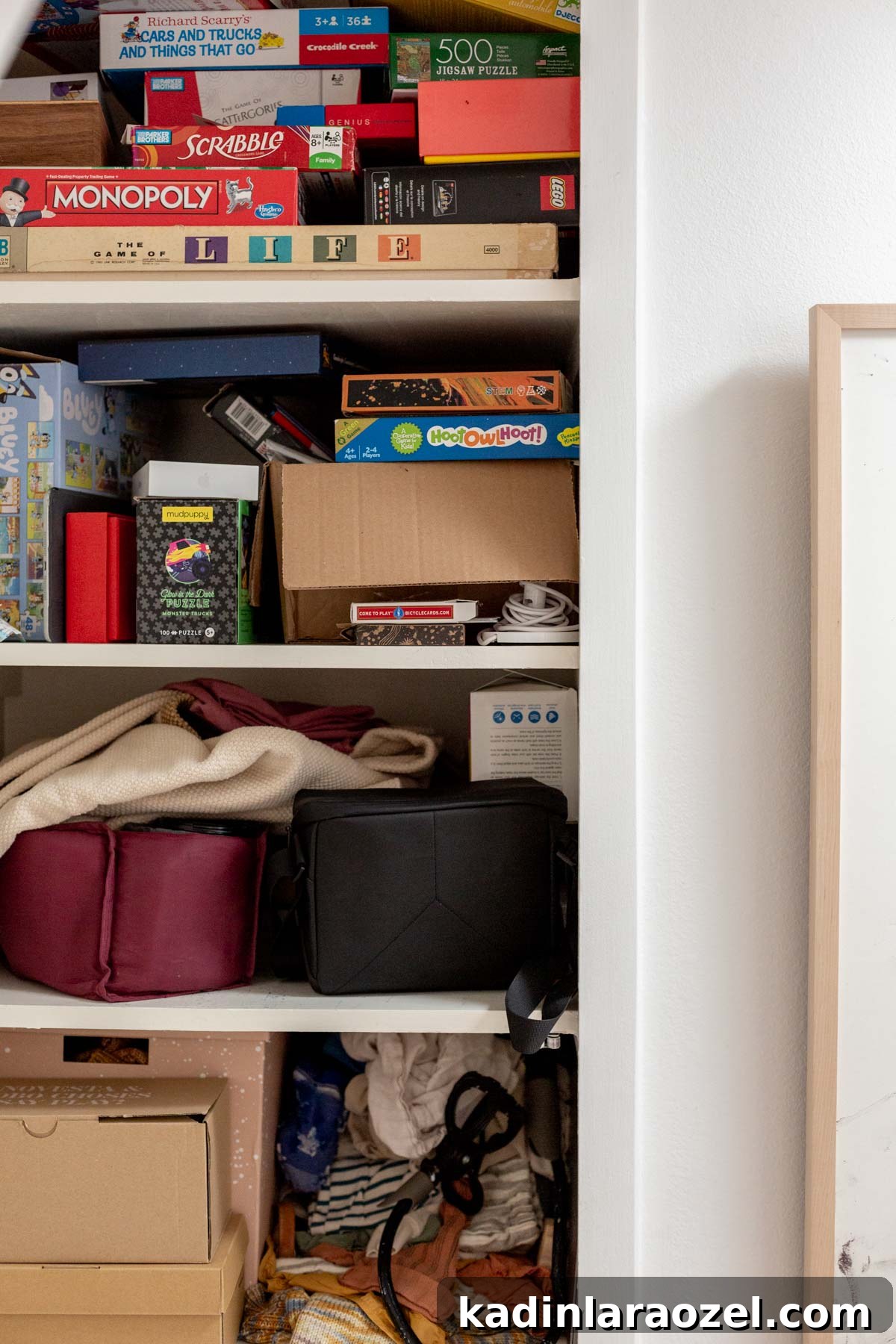 Messy hall closet filled with junk and household items