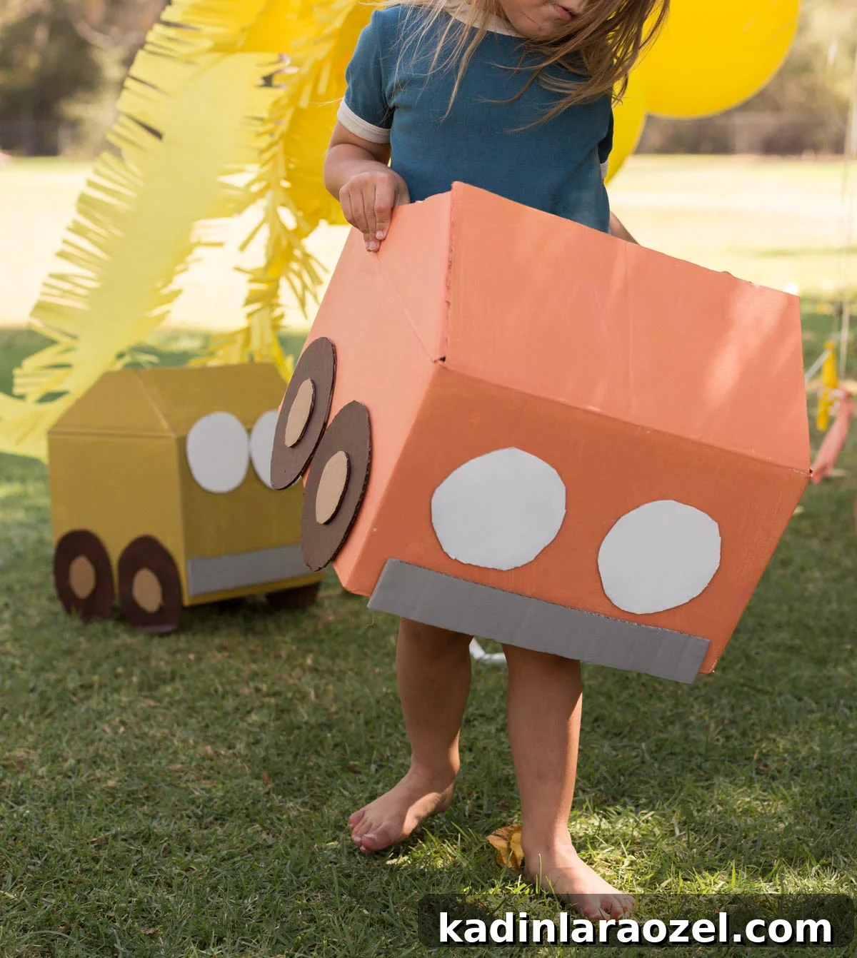 Construction and Car-Themed Birthday Party Ideas for Kids 2 child running around in a handmade cardboard car for a birthday party