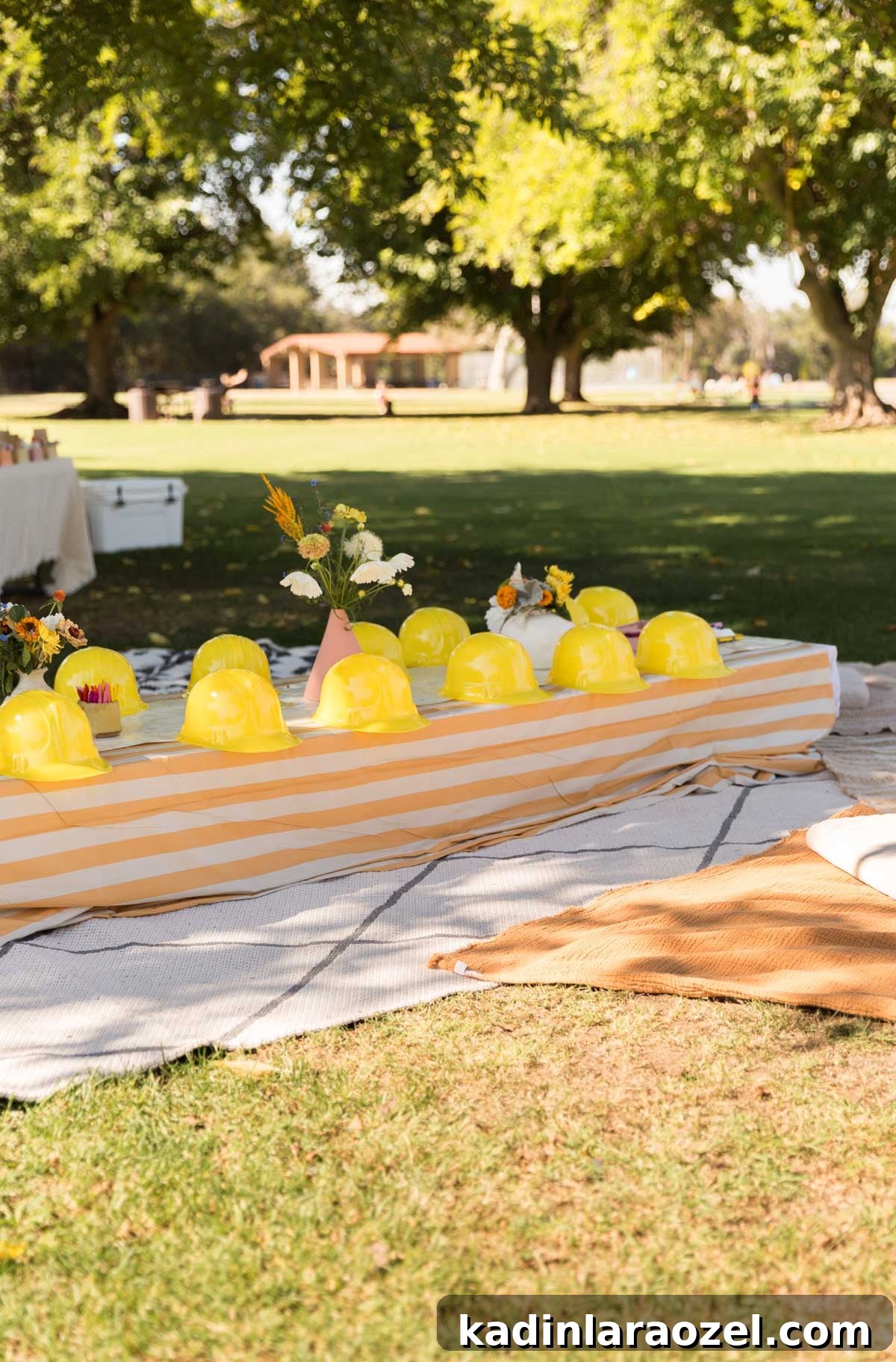 Construction and Car-Themed Birthday Party Ideas for Kids 5 low table with striped tablecloth for a kids construction birthday party at a park