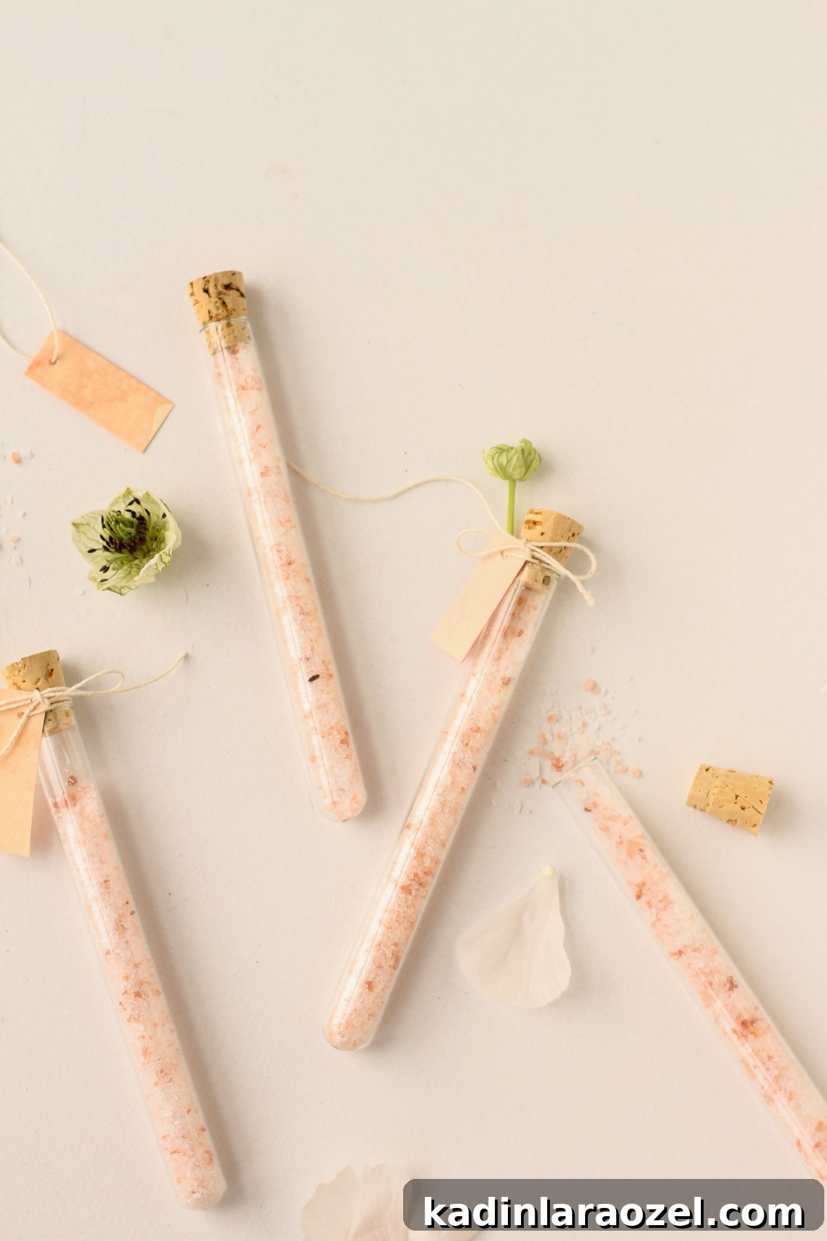 DIY Bath Salts Recipe for Memorable Wedding Favors 10 pretty glass vials filled with pink salt mixture