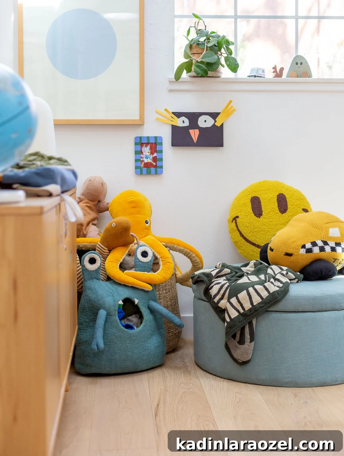round blue ottoman with colorful toys in a kids room 
