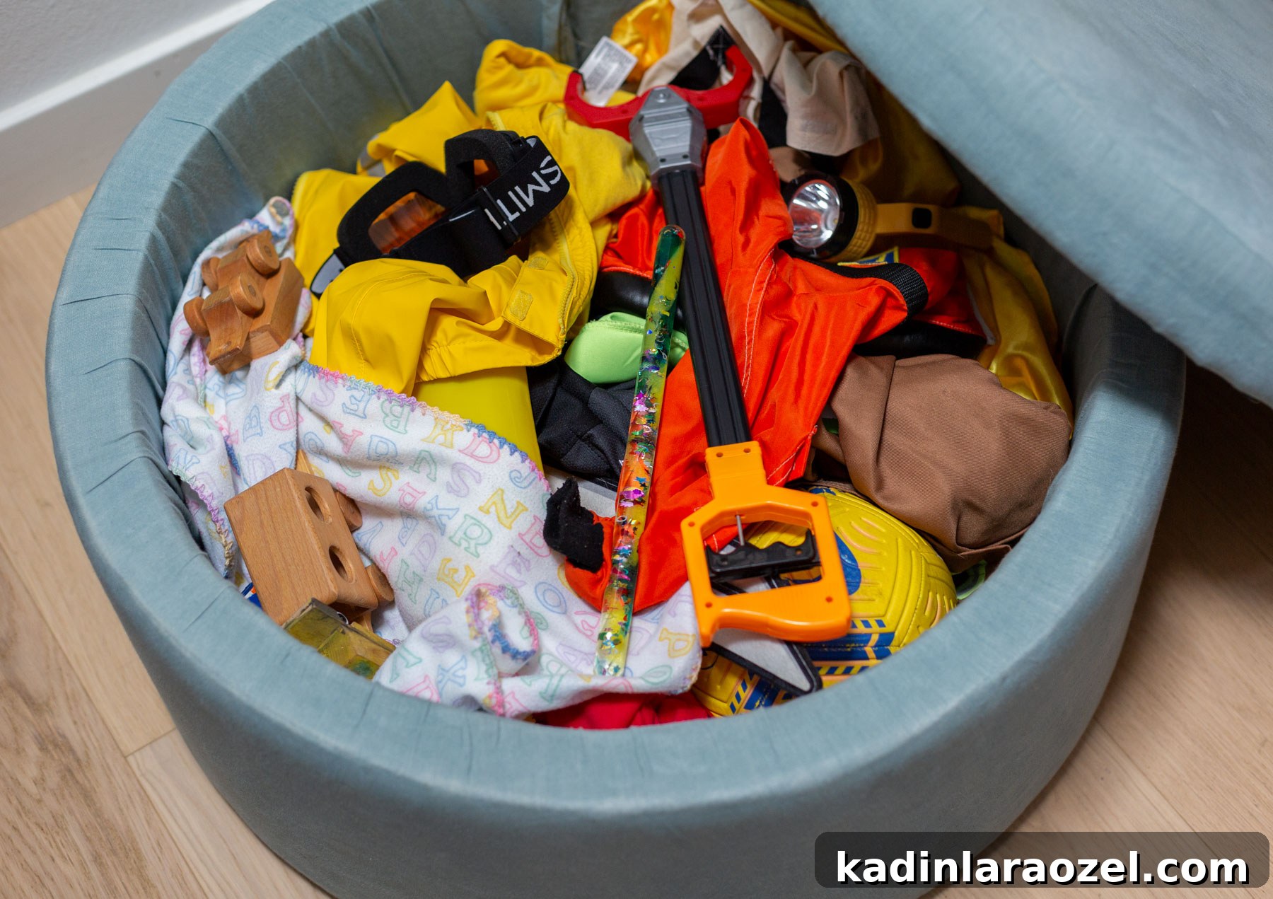 toys in a blue storage ottoman