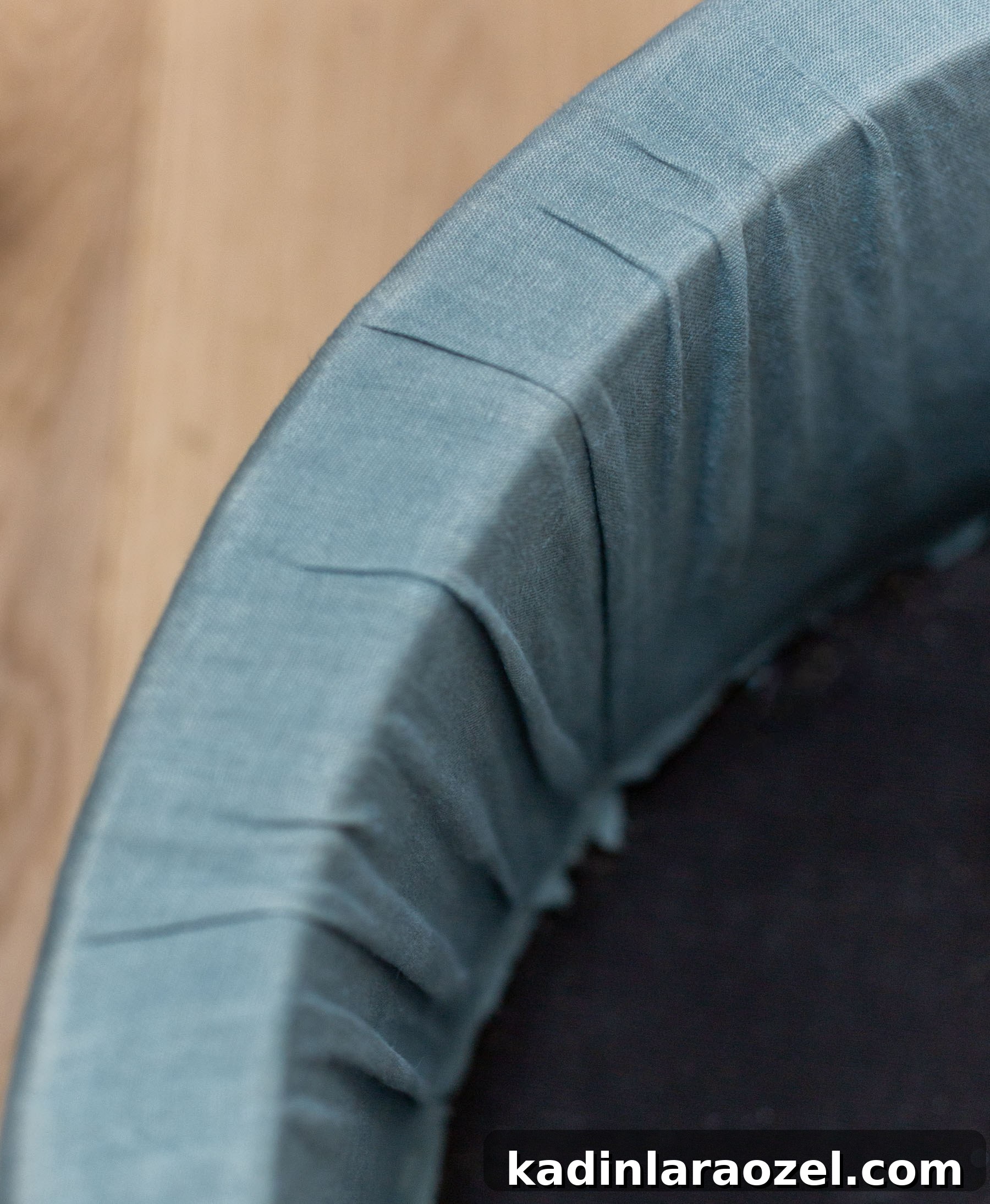 instructions for reupholstering a round ottoman in blue fabric