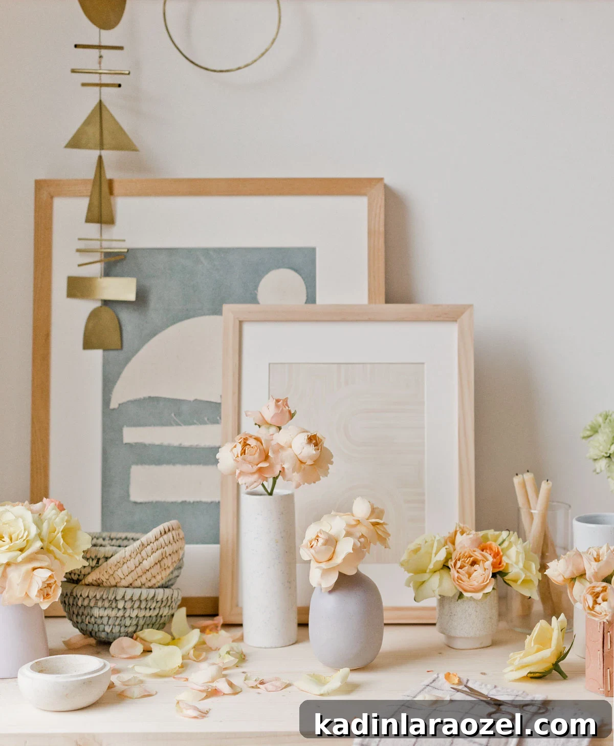 Instant Ways to Upgrade Grocery Store Flowers for Stunning Bouquets 2 beautiful pastel flowers in modern simple vases, sitting on a wood desk