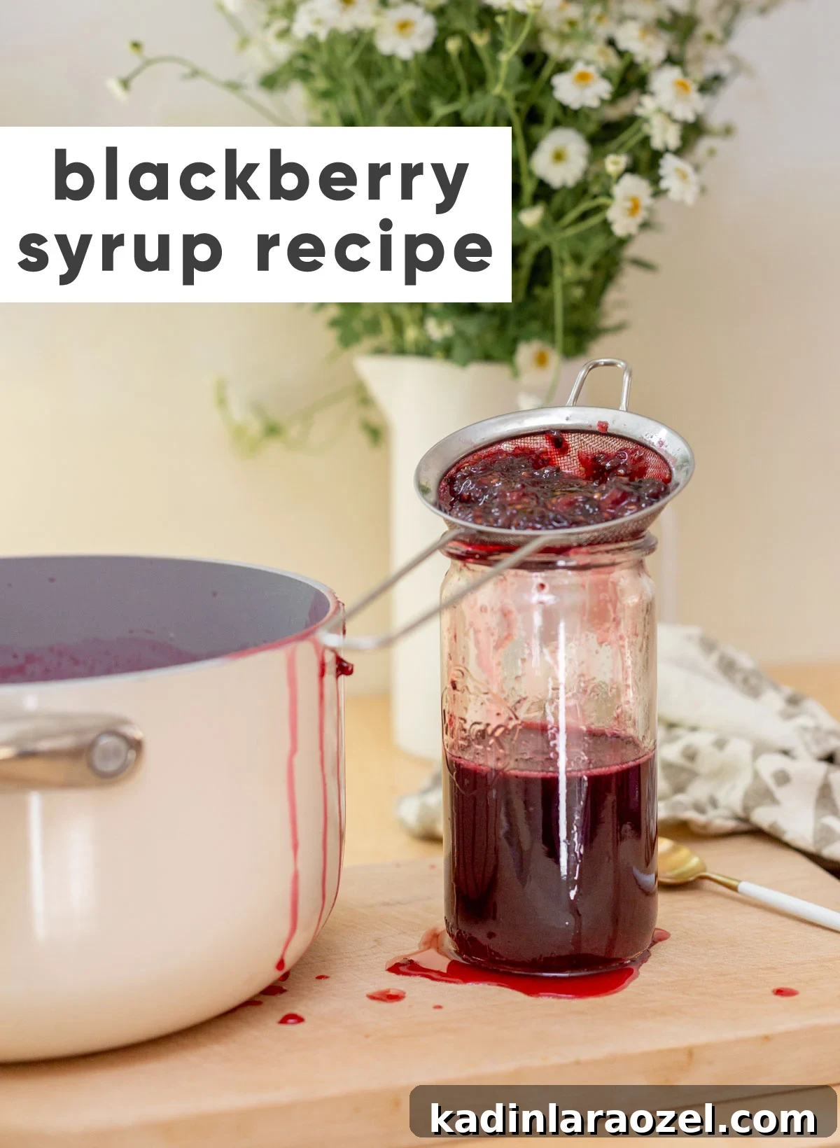 Three-Ingredient Blackberry Syrup Recipe for Pancakes and Desserts 8 Straining blackberries into a glass jar to make syrup for cocktails