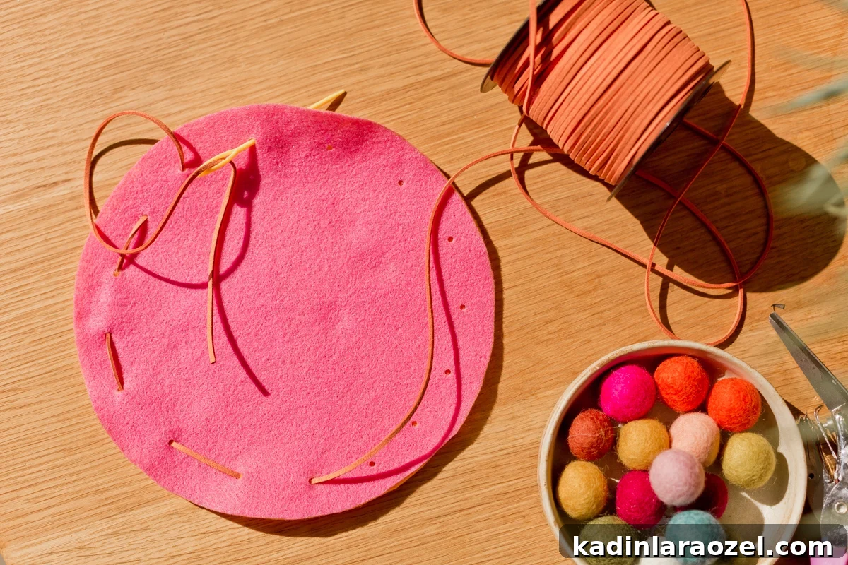 DIY Drawstring Pouch: Step-by-Step Sewing Tutorial 6 making felt pouch, sewing needle and thread through circle felt pieces