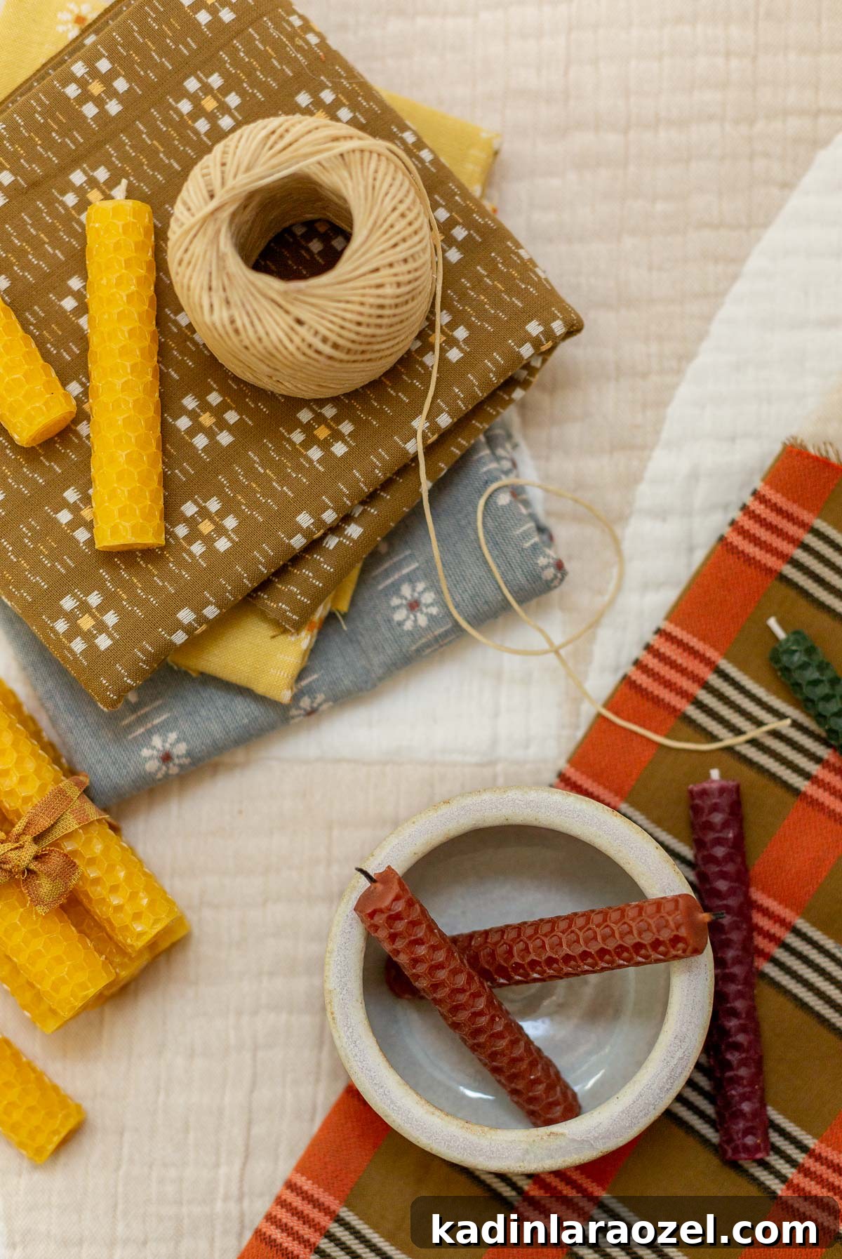 Make Rolled Beeswax Candles: Step-by-Step Guide for Beginners 12 craft supplies for making rolled candles and stacks of vintage fabrics
