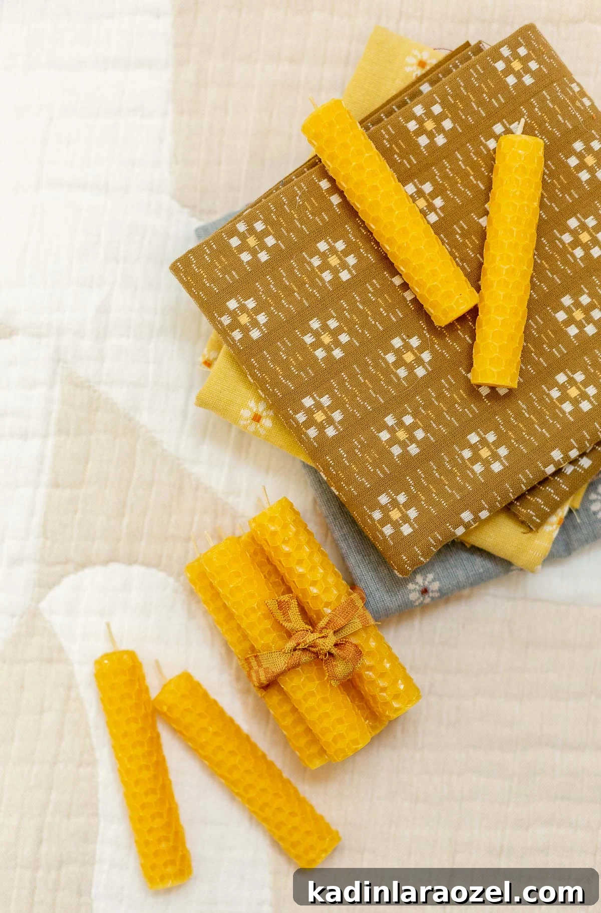 Make Rolled Beeswax Candles: Step-by-Step Guide for Beginners 13 homemade beeswax candles in small sets on a geometric background with neutral colors