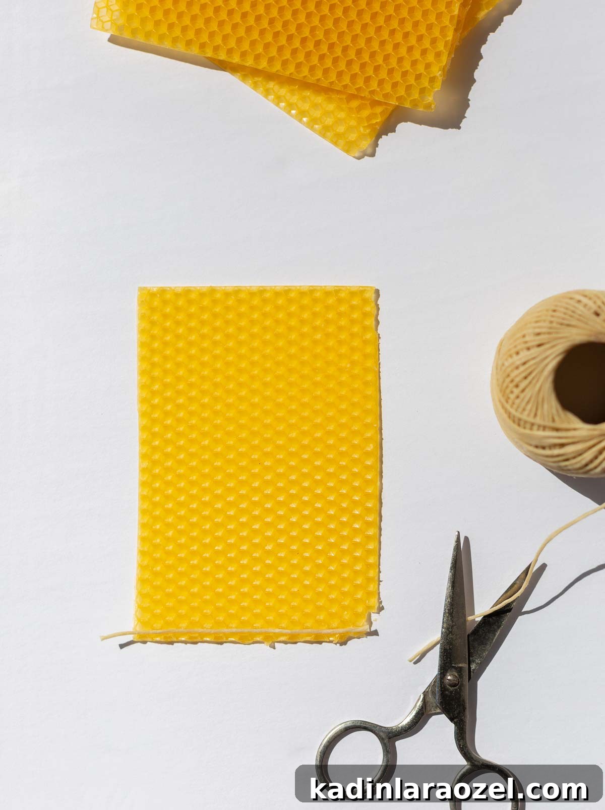 Make Rolled Beeswax Candles: Step-by-Step Guide for Beginners 4 materials laid out to make rolled beeswax candles