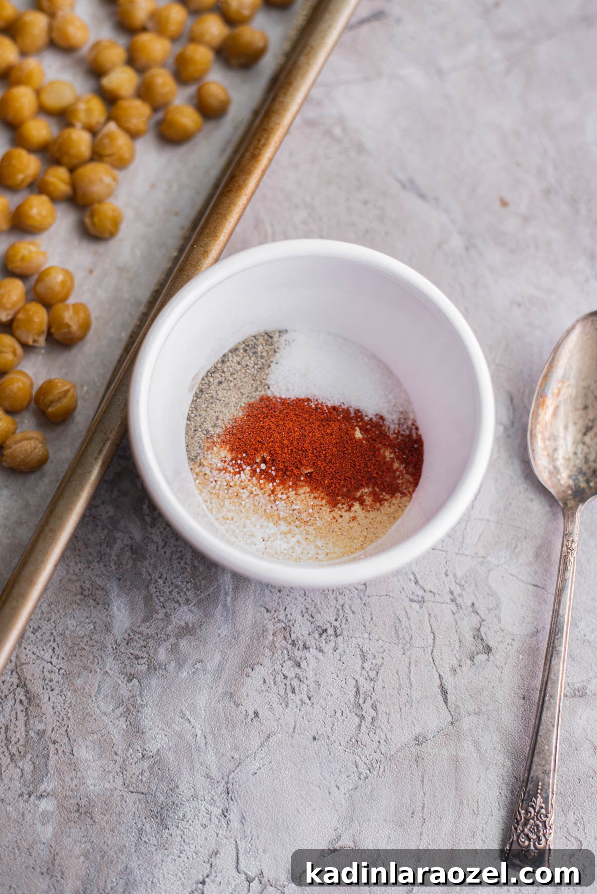 Crispy Roasted Chickpeas Recipe for Snack or Salad Topping 6 mixing spices together in a small bowl to make roasted chickpeas