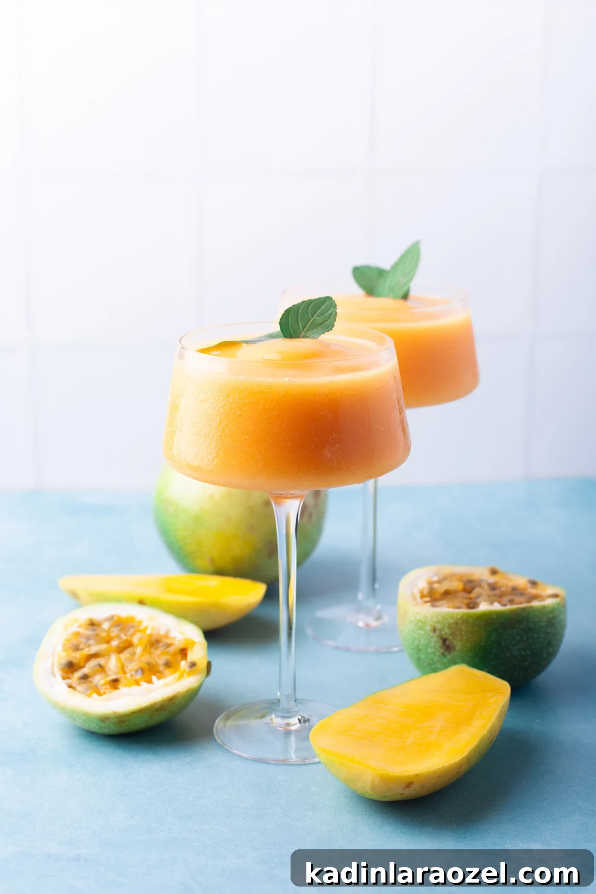 orange frozen cocktails with mint sprigs 