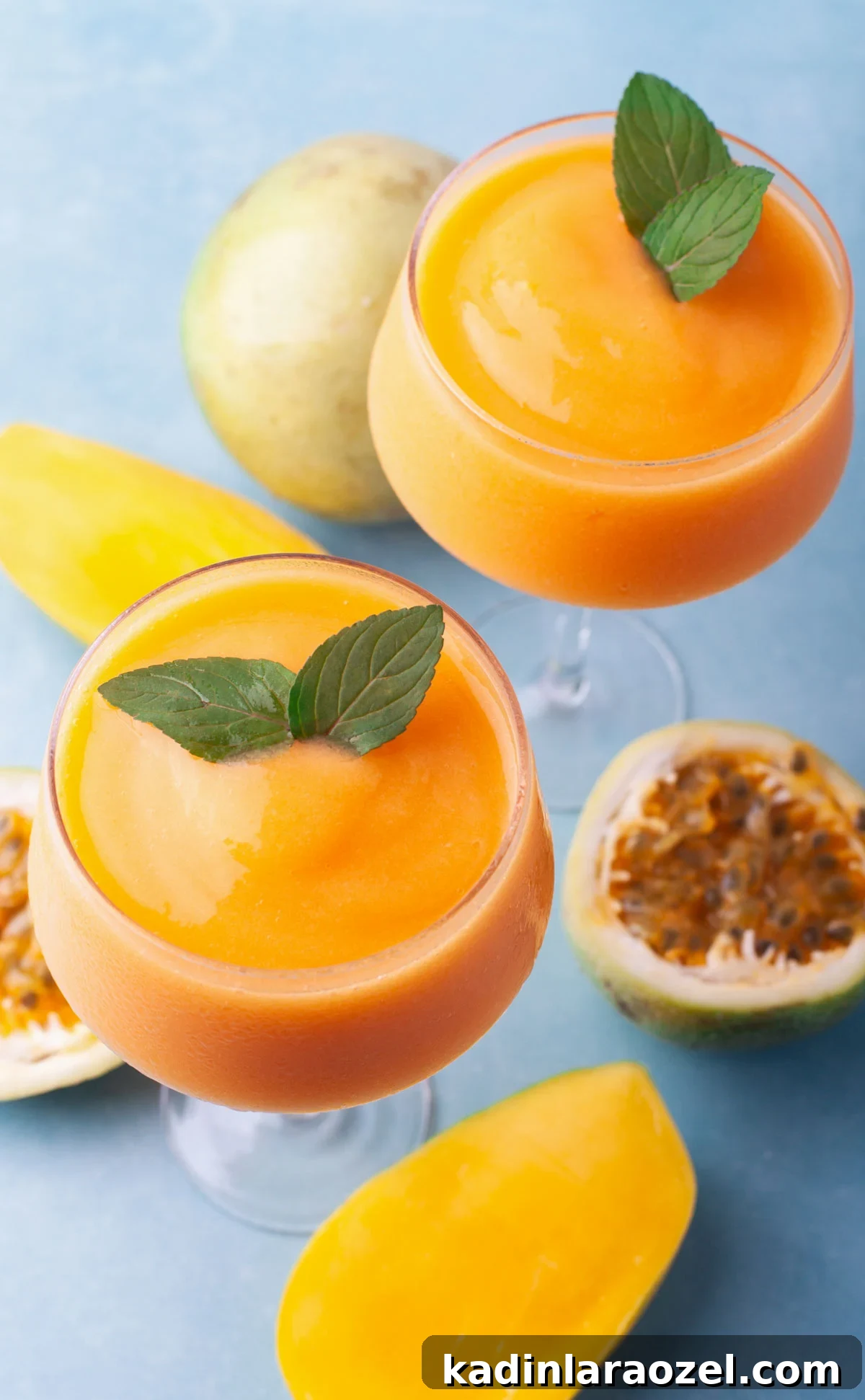 closeup overhead orange frozen cocktail on blue counter for summer