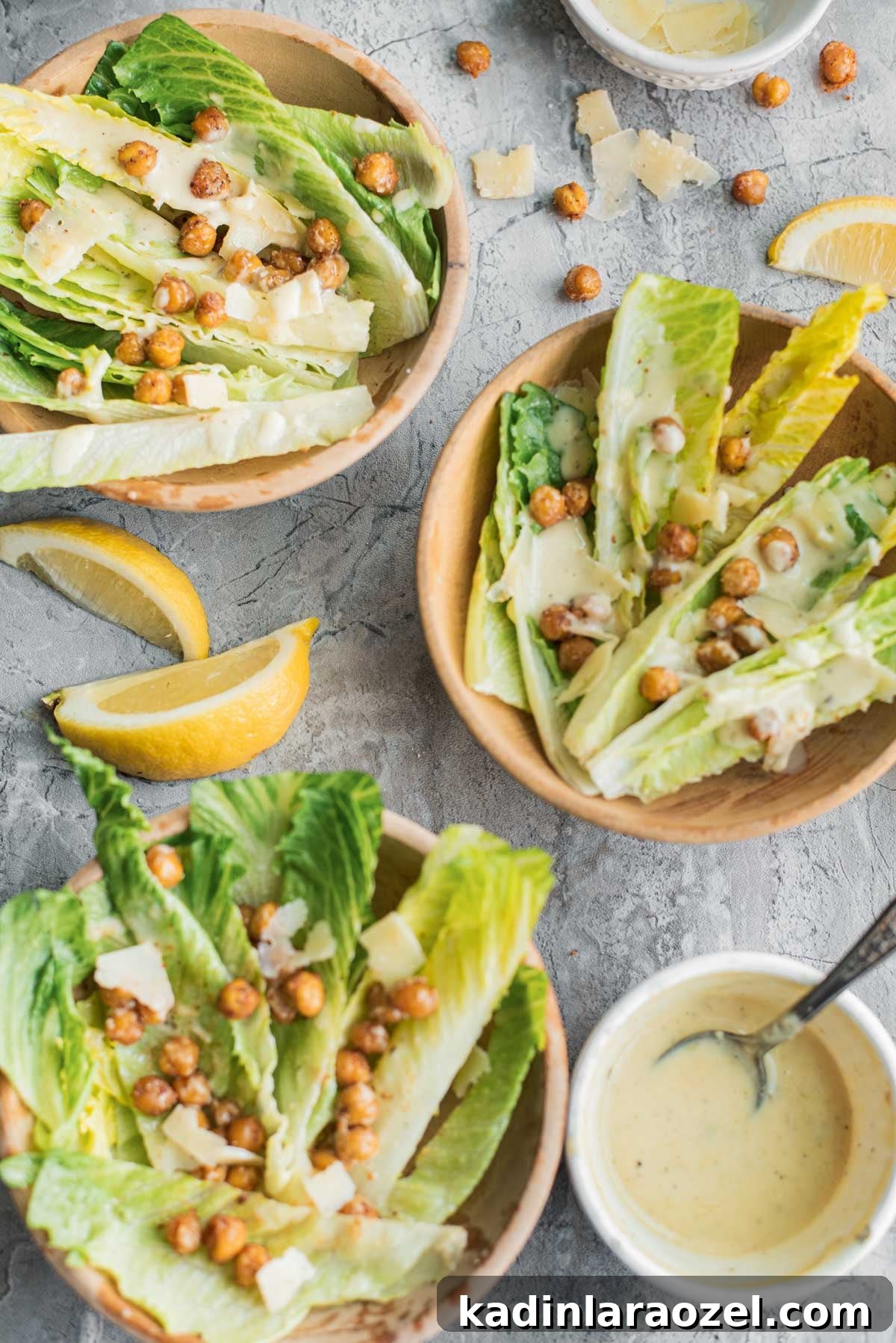 small bowls of crispy chickpea salad with homemade dressing and lemon slices