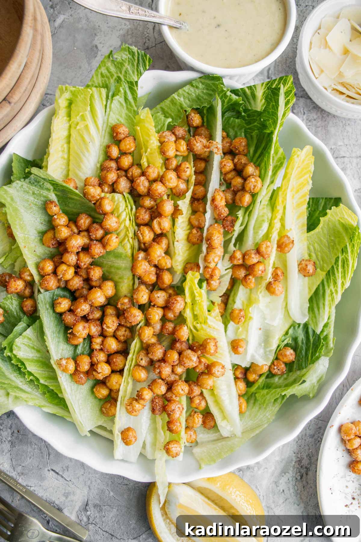 roasted chickpeas on top of a bed of romaine lettuce