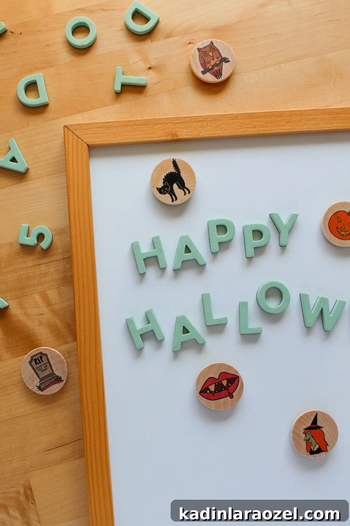 wooden halloween magnets on a white board