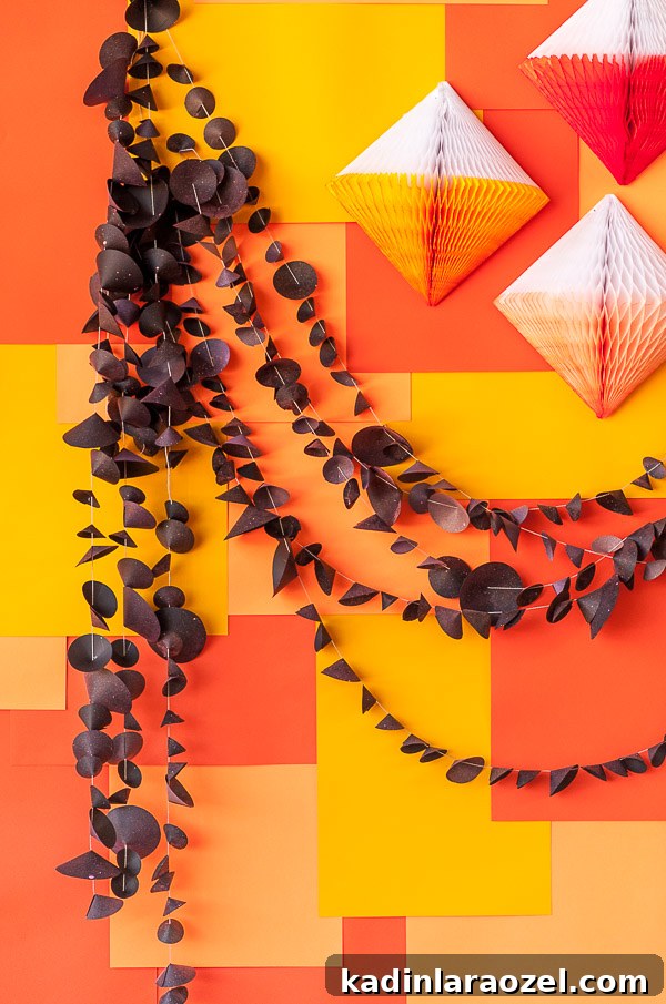 black witch hat halloween garland with orange background