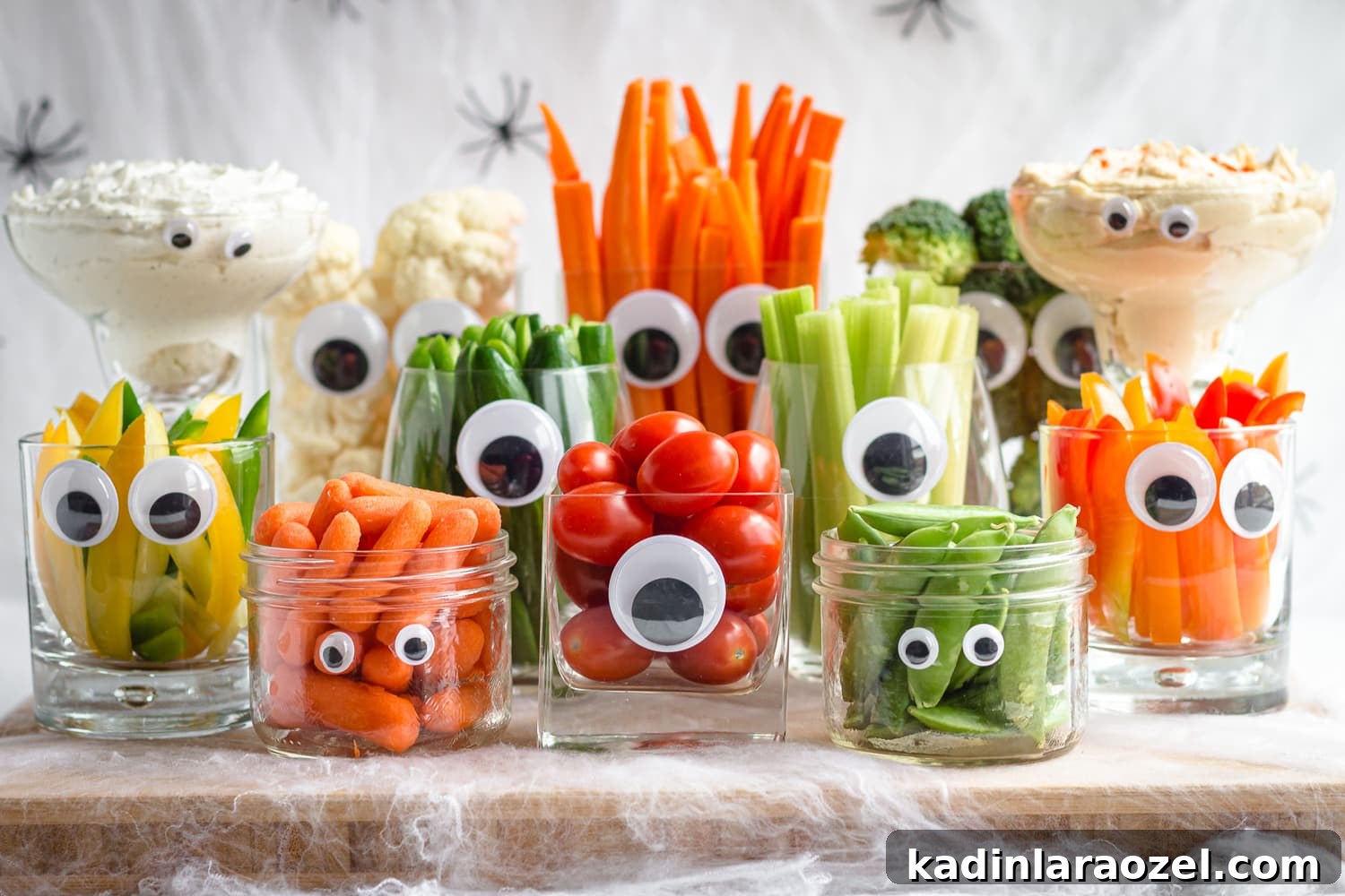 veggies in clear jars with googly eyes for halloween party