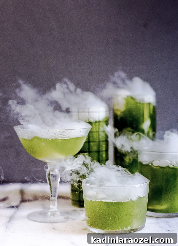 green spooky cocktails for halloween with dry ice