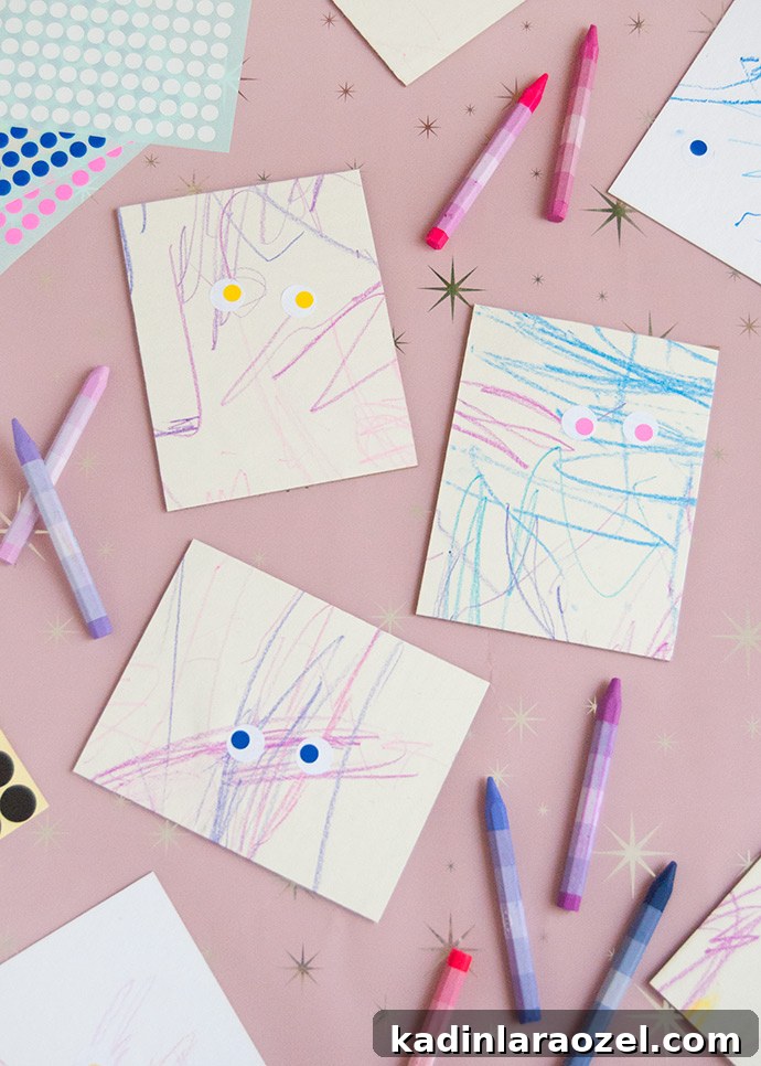 scribbles on paper from kids with eye shaped stickers on them to look like mini monster art