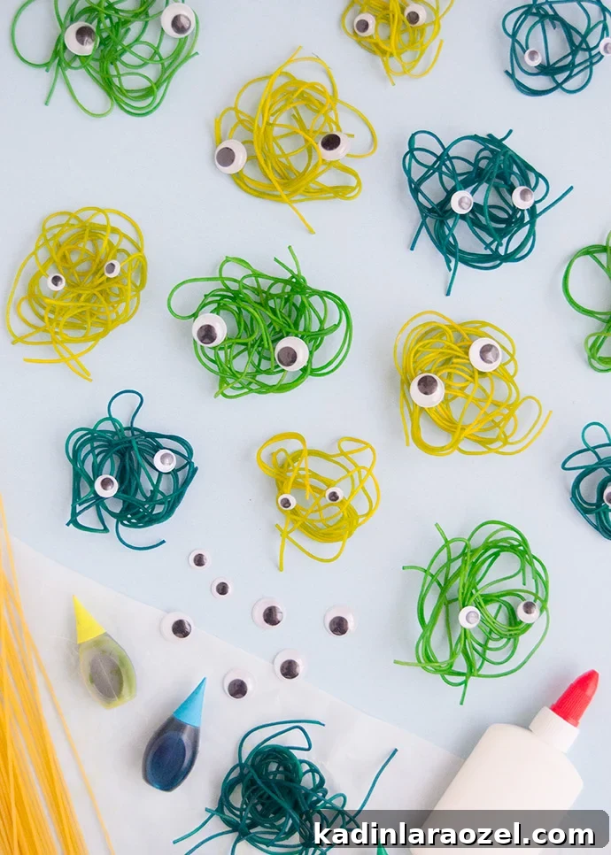 string little craft with googly eyes on it to look like mini monsters for halloween
