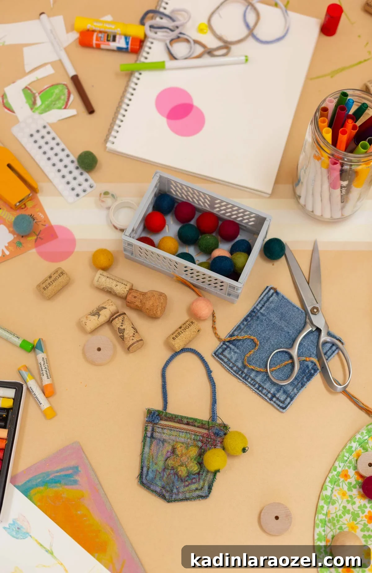 DIY No-Sew Kids' Purse from Old Jeans 12 cluttered beige table filled with kids craft supplies