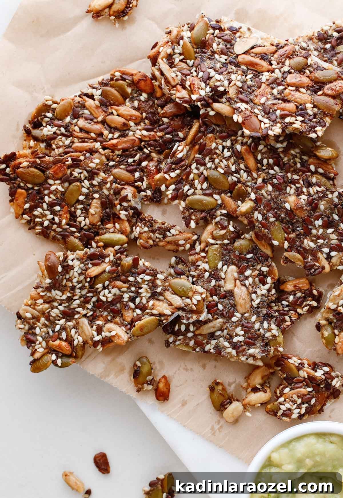 Crispy Seed Crackers Recipe: Homemade Savory Snack 14 closeup of seed cracker with sesame seeds, chia seeds, sunflower seeds, and more