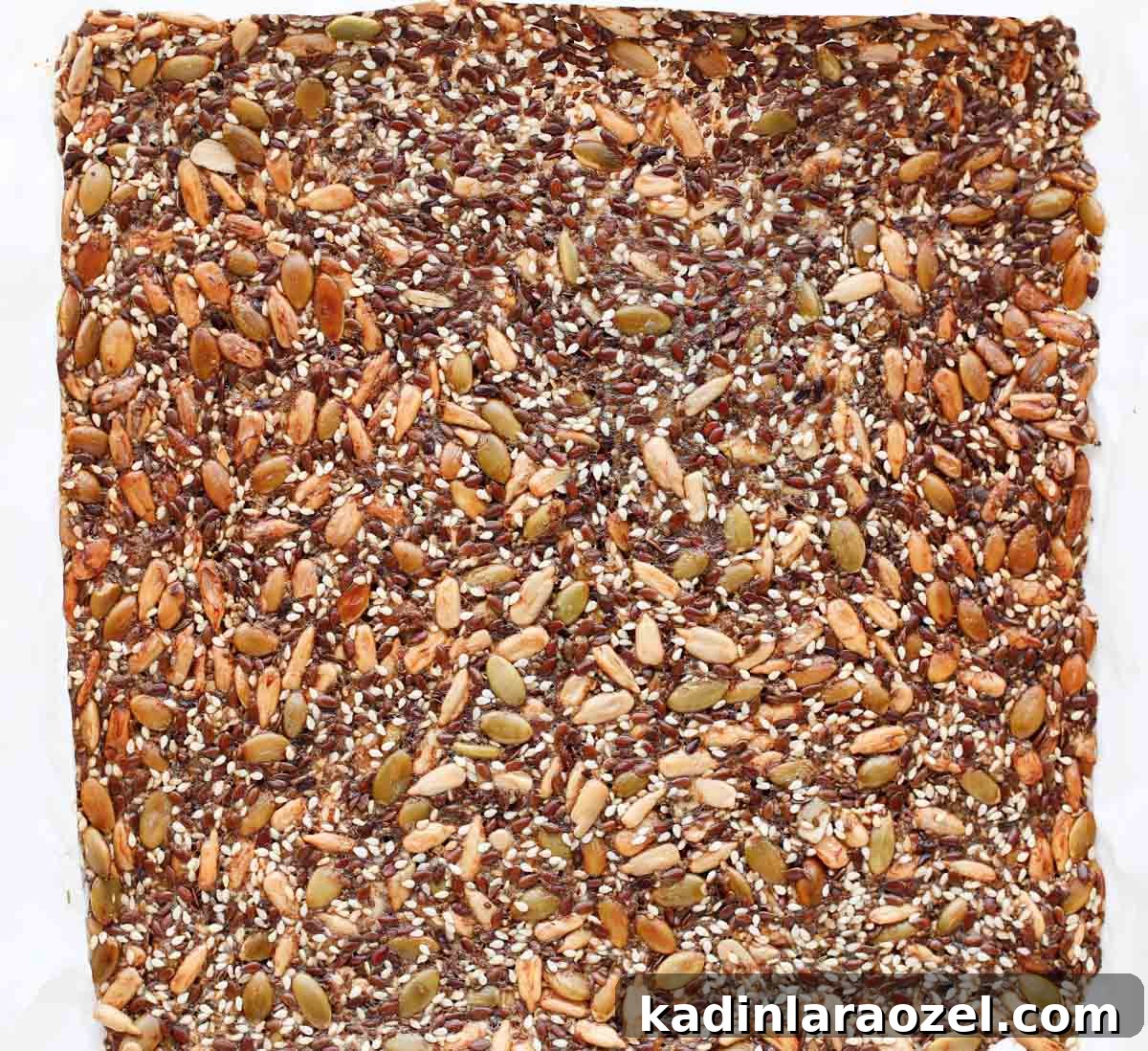 Crispy Seed Crackers Recipe: Homemade Savory Snack 8 seed crackers after they've been baked, but have not been broken apart into individual crackers yet
