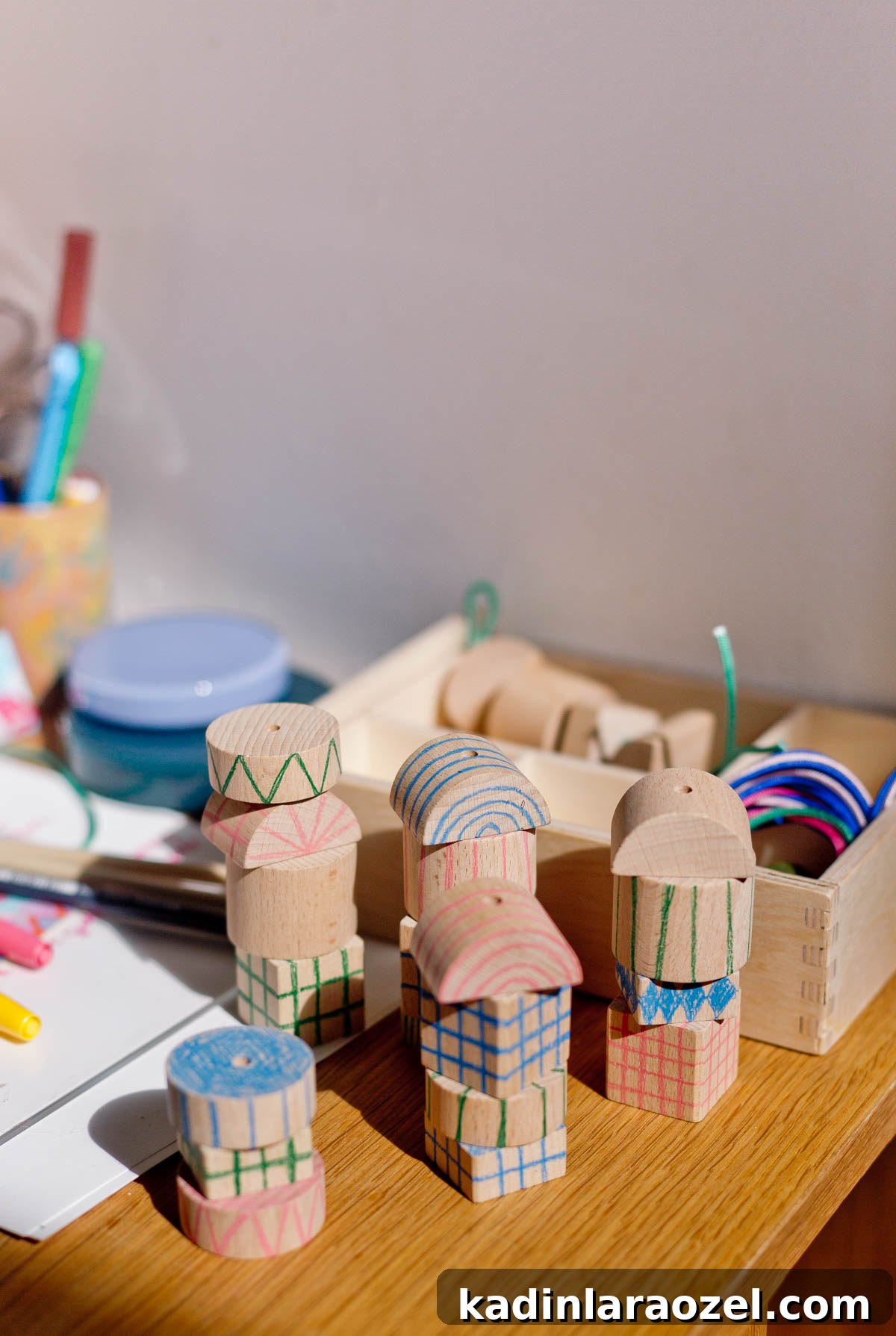 stacked wood blocks with hand drawn patterns on them