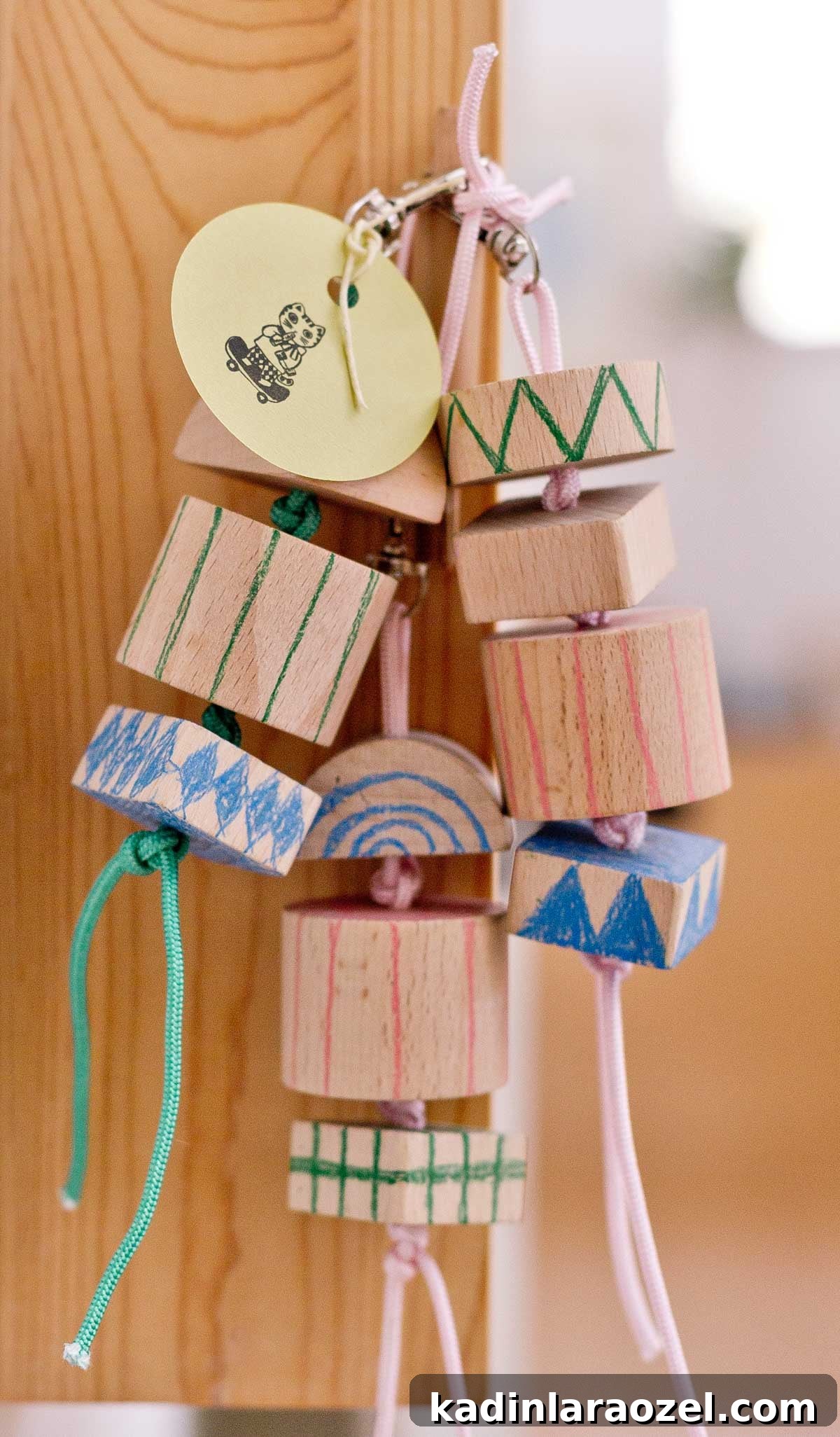 group of chunky wood keychains with hand drawn patterns on them - cute for kids