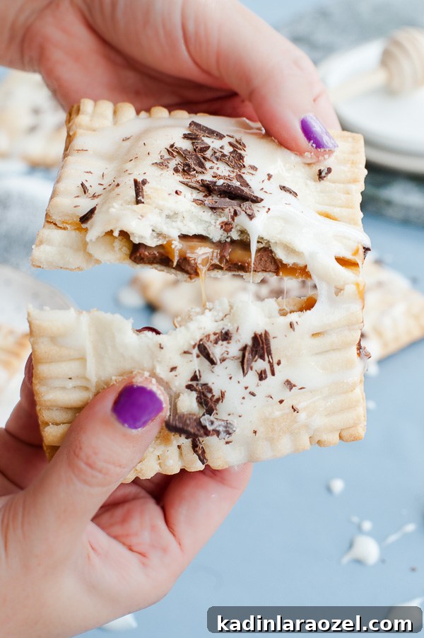 27 Spooky Halloween Desserts to Delight Your Guests 24 homemade s'more pop tarts being broken open