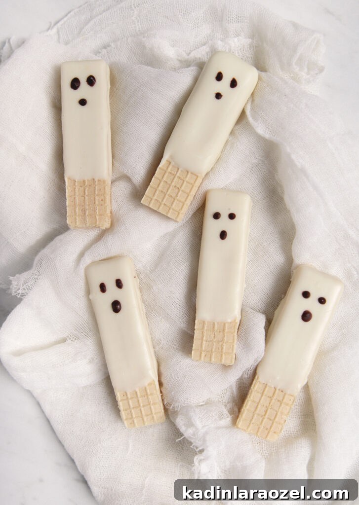 27 Spooky Halloween Desserts to Delight Your Guests 28 sugar wafer halloween treats that look like cute little ghosts