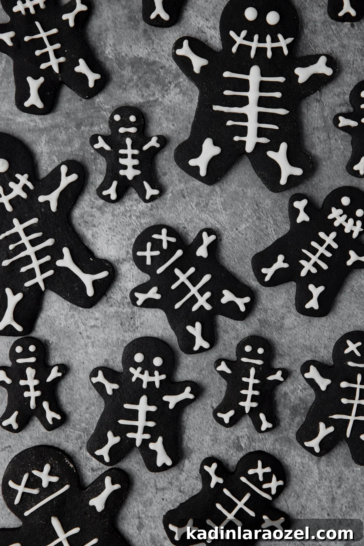 27 Spooky Halloween Desserts to Delight Your Guests 7 black cocoa skeleton cookies with royal icing decoration