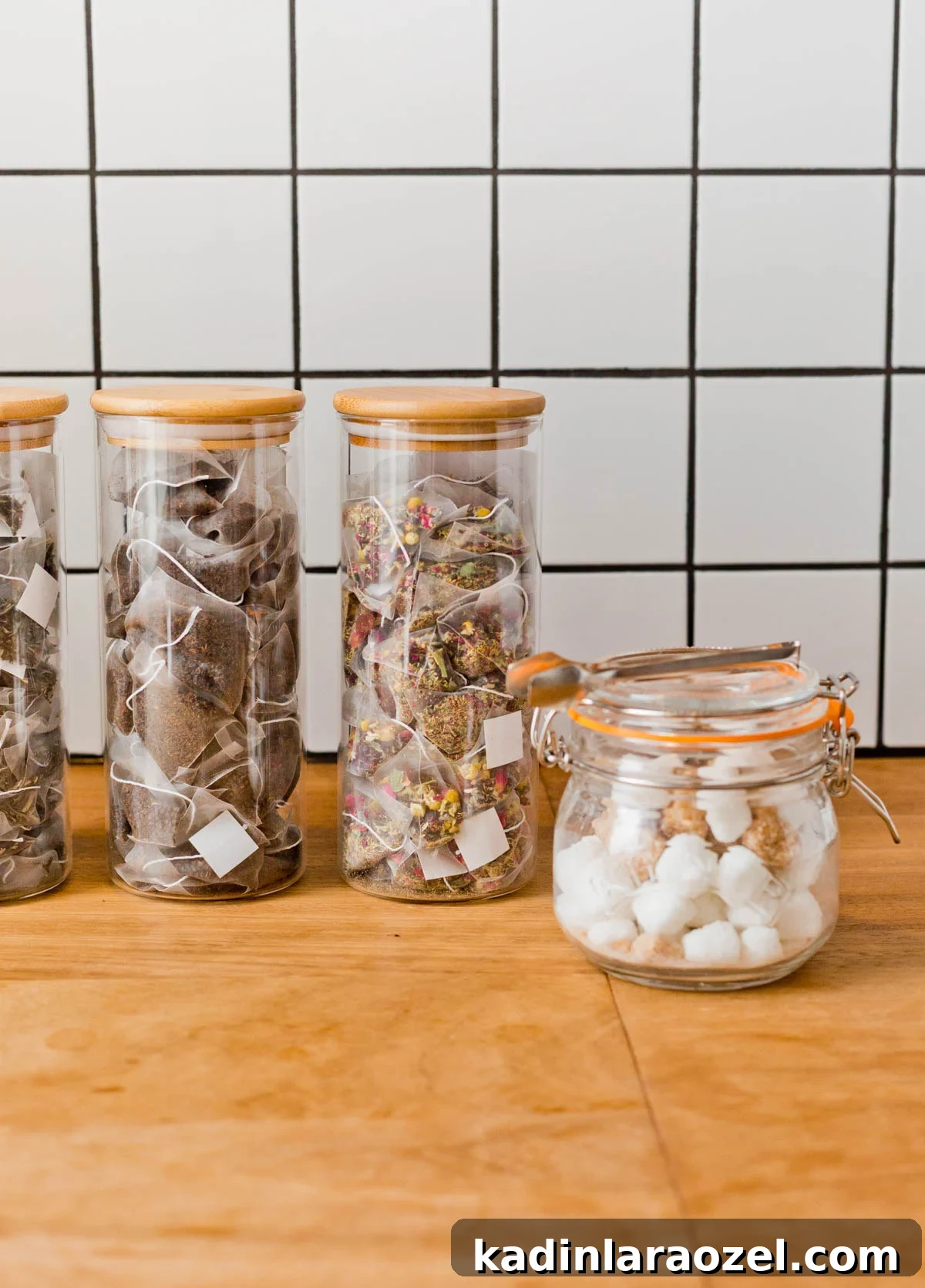 glass jars filled with tea bags and sugar cubes