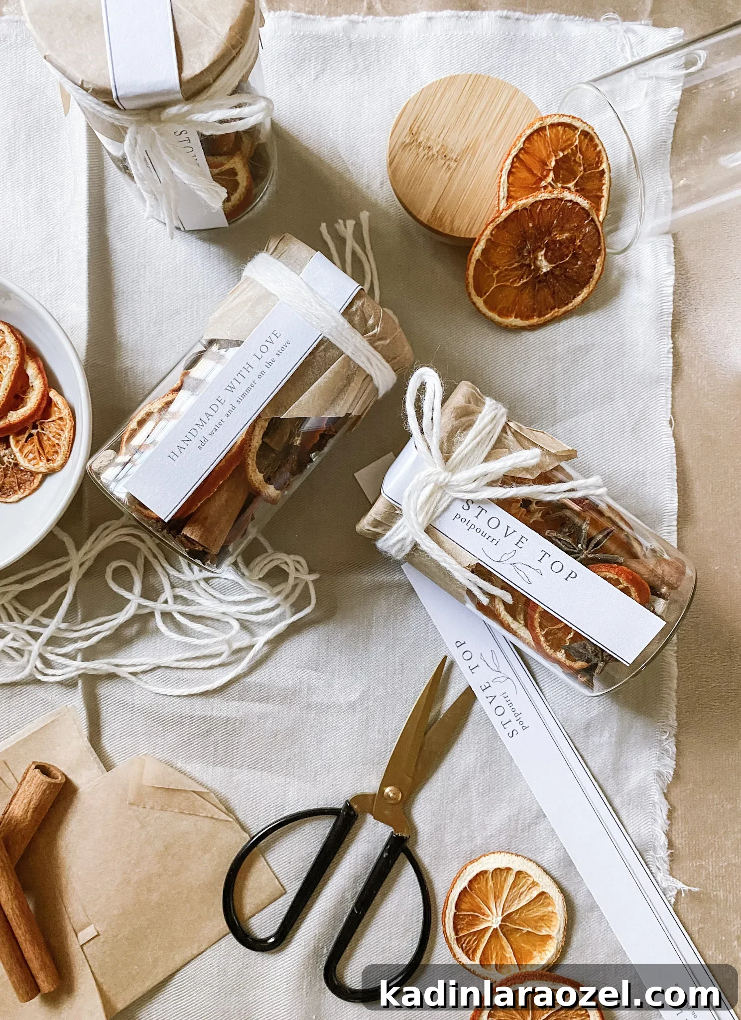 stove top potpourri being packaged in glass jars with twine and cute minimal tags