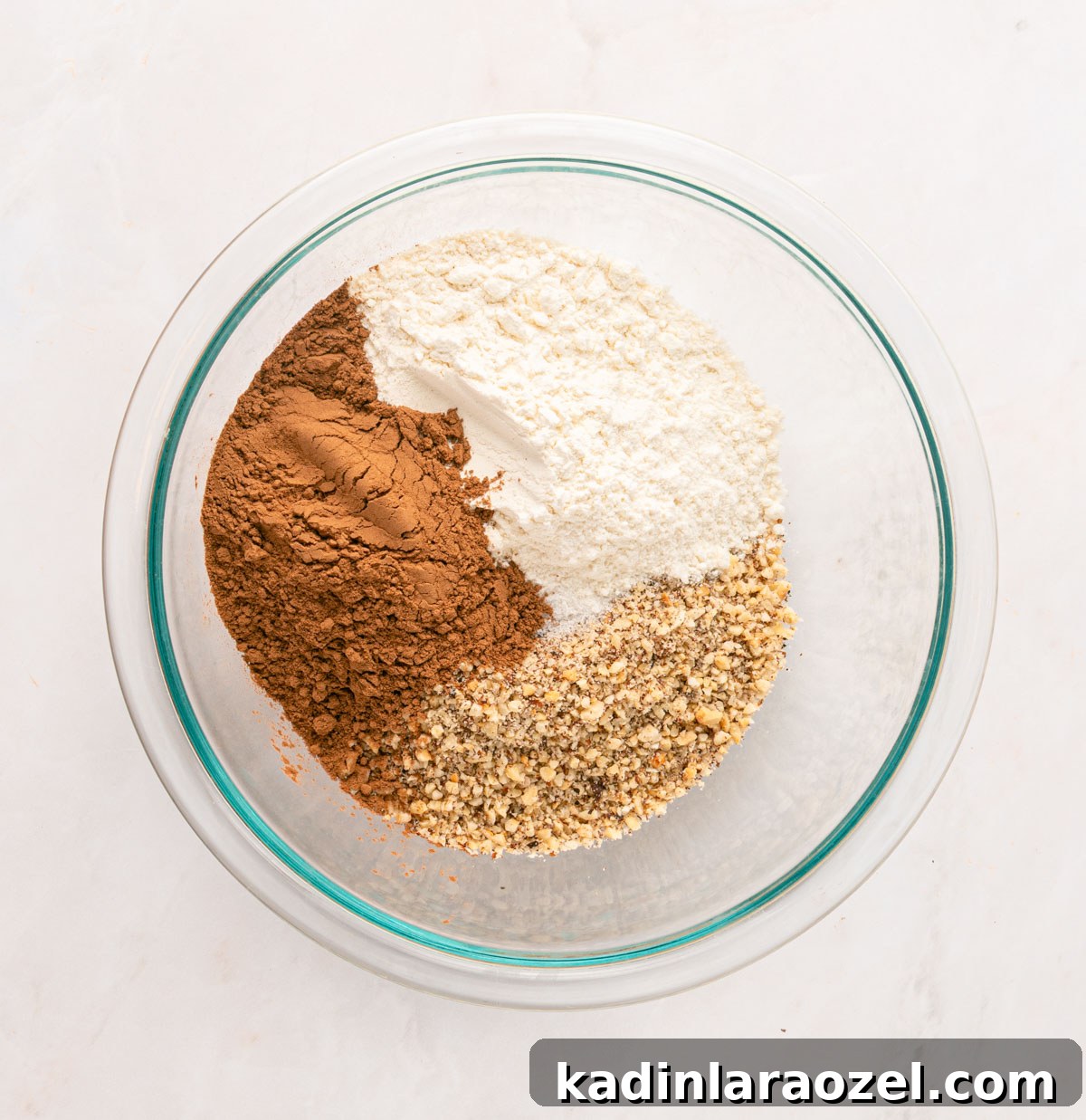 Decadent Chocolate Hazelnut Cookie Recipe 5 mixing ingredients for linzer cookies in a glass bowl