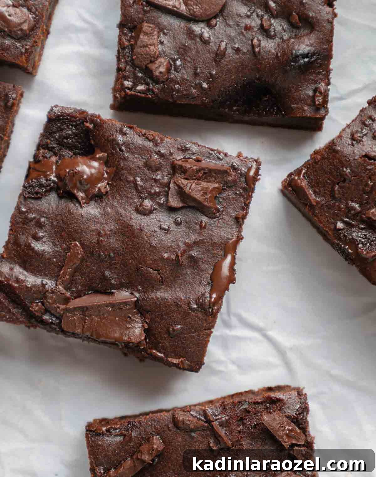 square brownies with melted chocolate and chocolate chunks on top