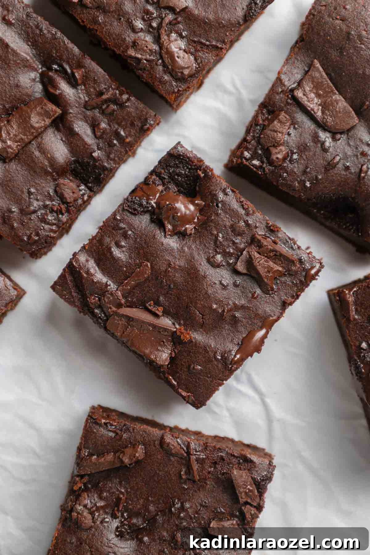 sweet potato brownies cut into squares, ready to eat with melty chocolate