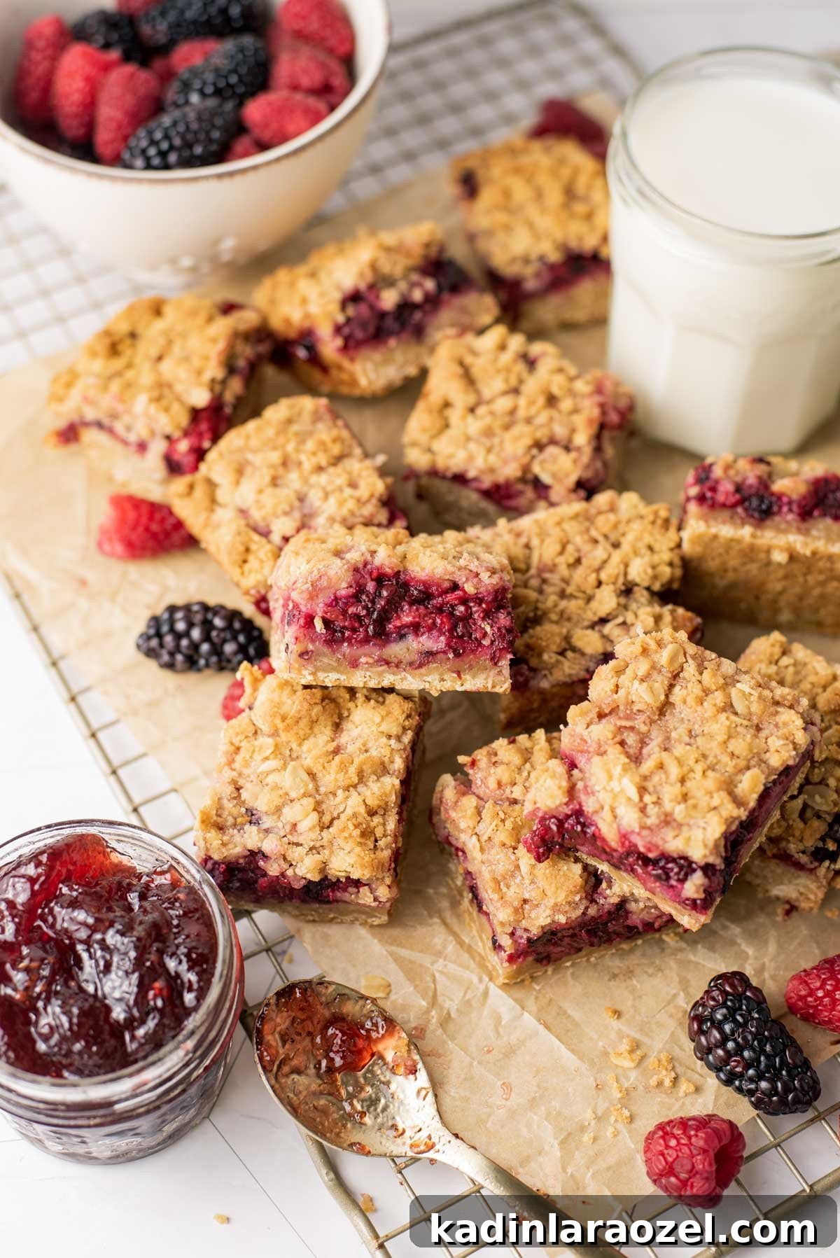 Berry Oat Shortbread Bars — Tender Crust with Fresh Berries 11 cut up shortbread bars with milk and jam