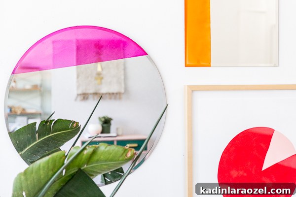 Hanging colorful mirrors that are color blocked using a special paint and a simple DIY technique.