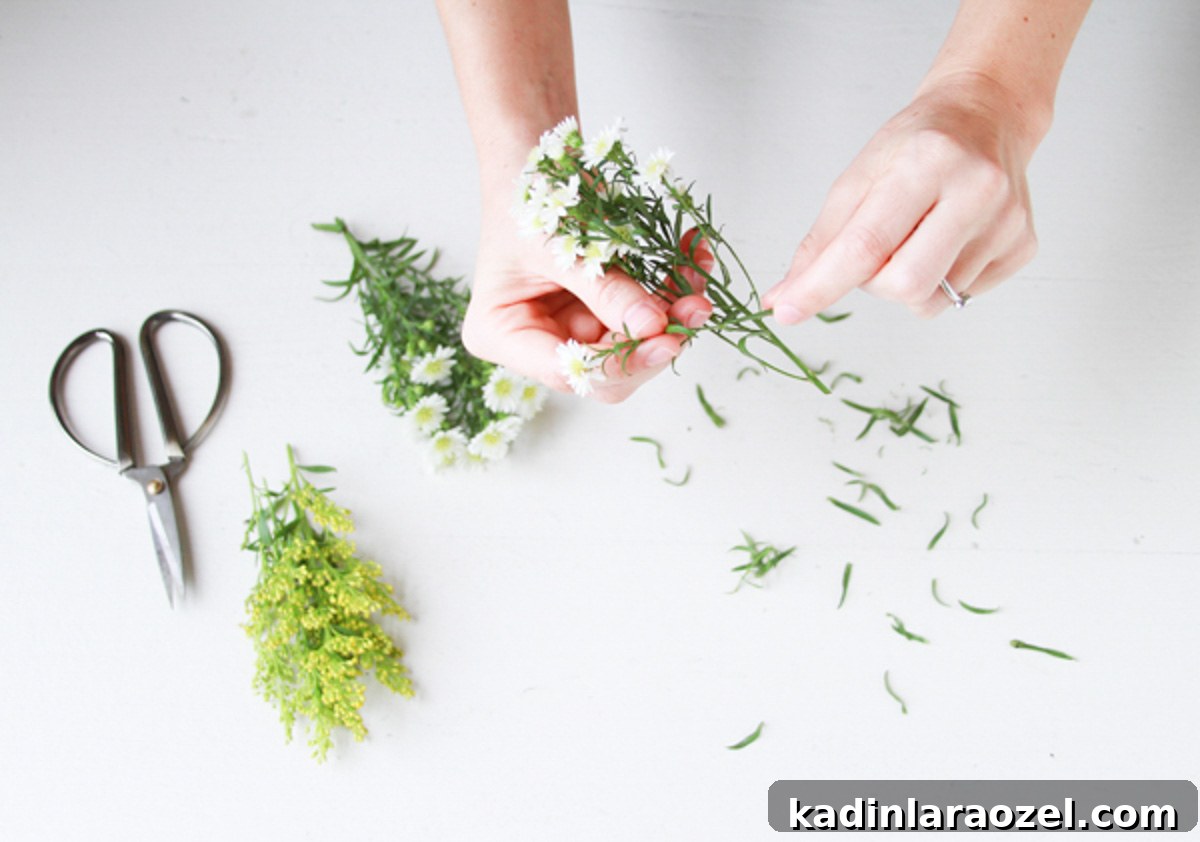 making small flower bouquet with several types of small flowers