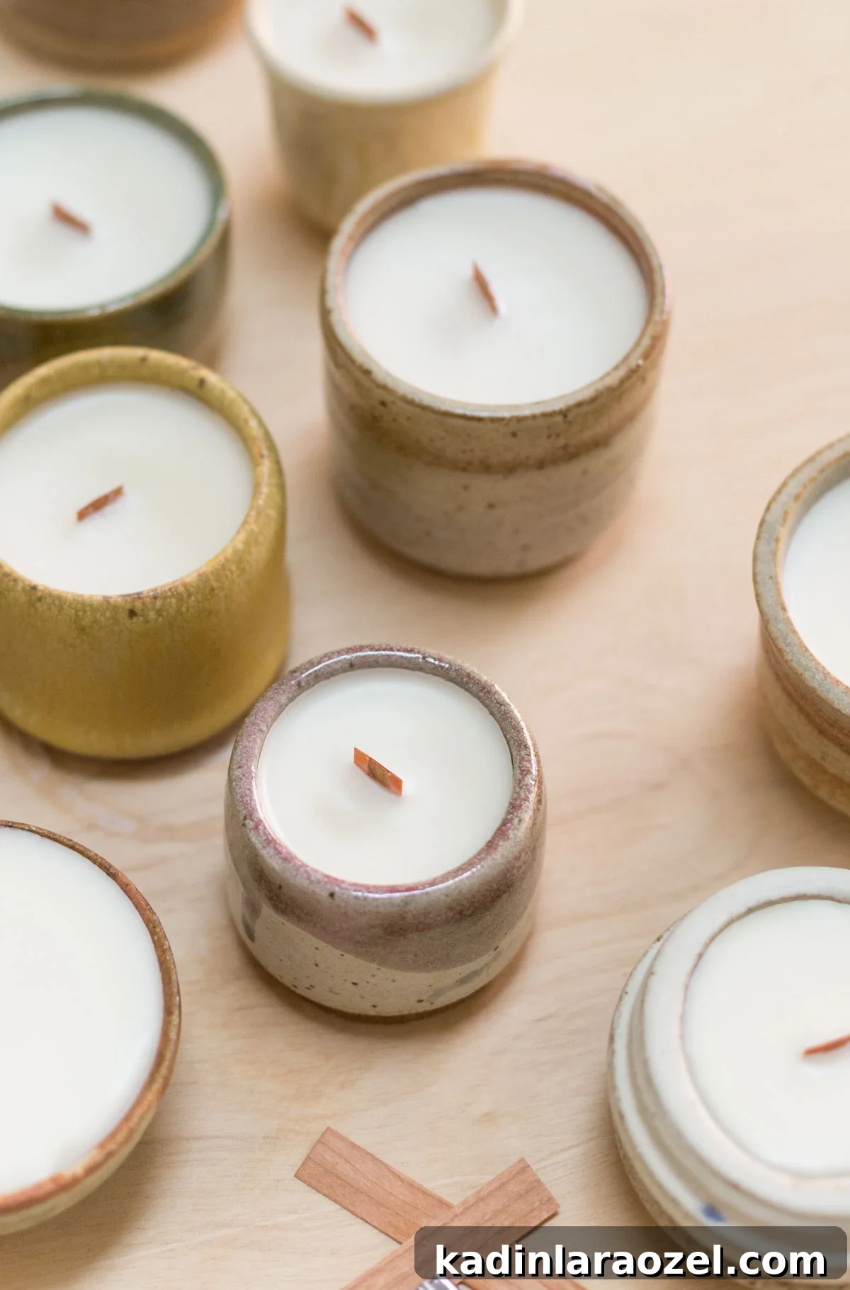 Complete Guide to Crafting Soy Candles at Home 2 Homemade candles in handmade pottery containers