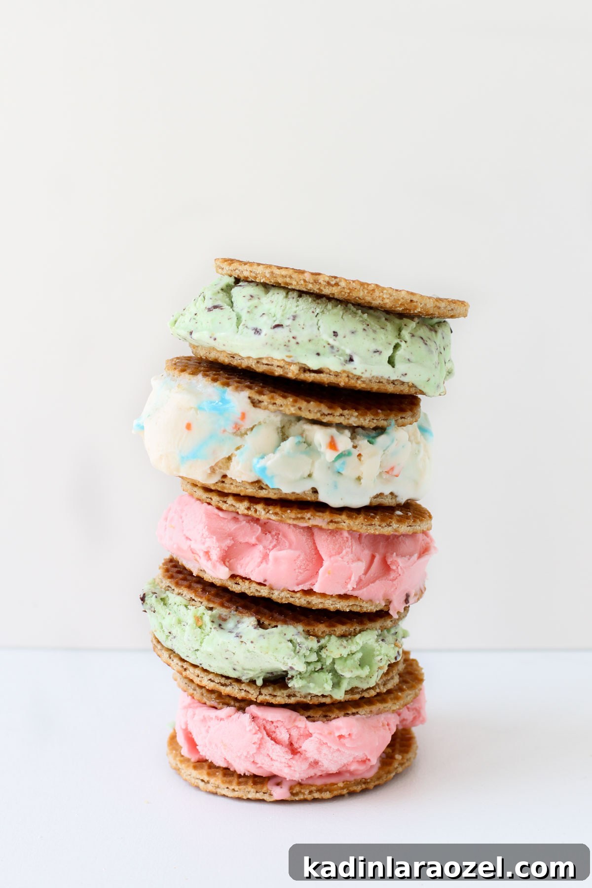 Stroopwafel Ice Cream Sandwich Recipe: Chewy Caramel Treats 5 Stacked ice cream sandwiches made with stroopwafels and various ice cream flavors