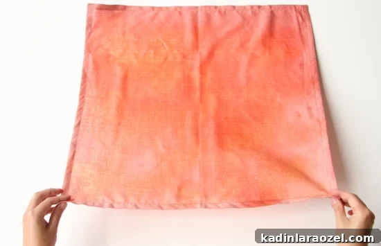 Step showing how to use bleach to create a subtle acid wash pattern with your linens.