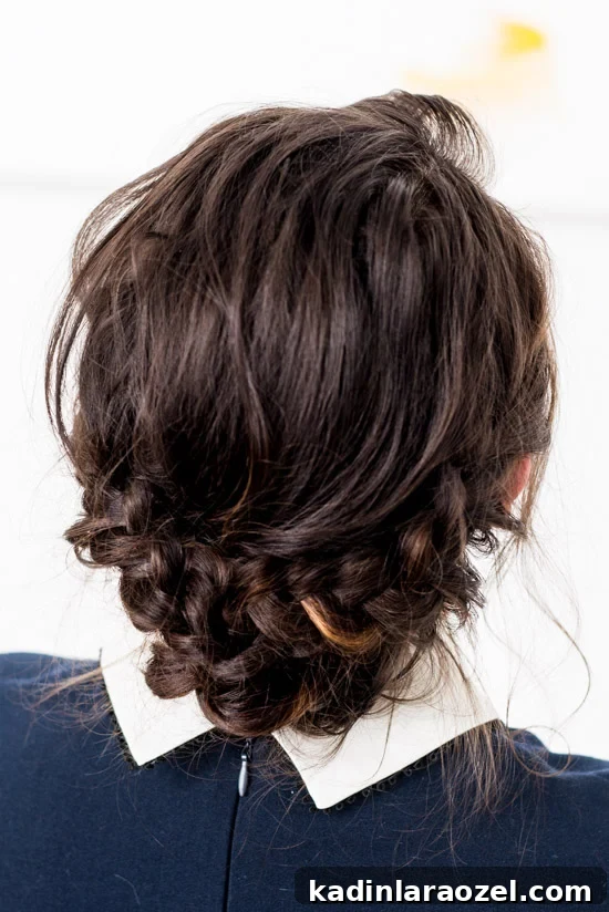 Quick Reverse Crown Braid Tutorial: Stylish Look in 15 Minutes 3 Back of brunette woman's head, that shows an intricate braided hair style