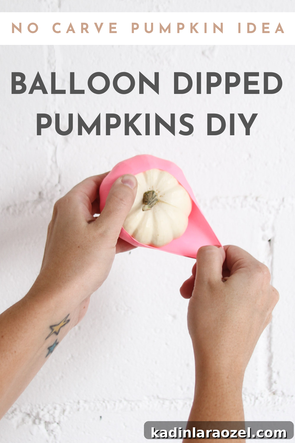 stretching pink balloon over white pumpkin with text description on top of the image